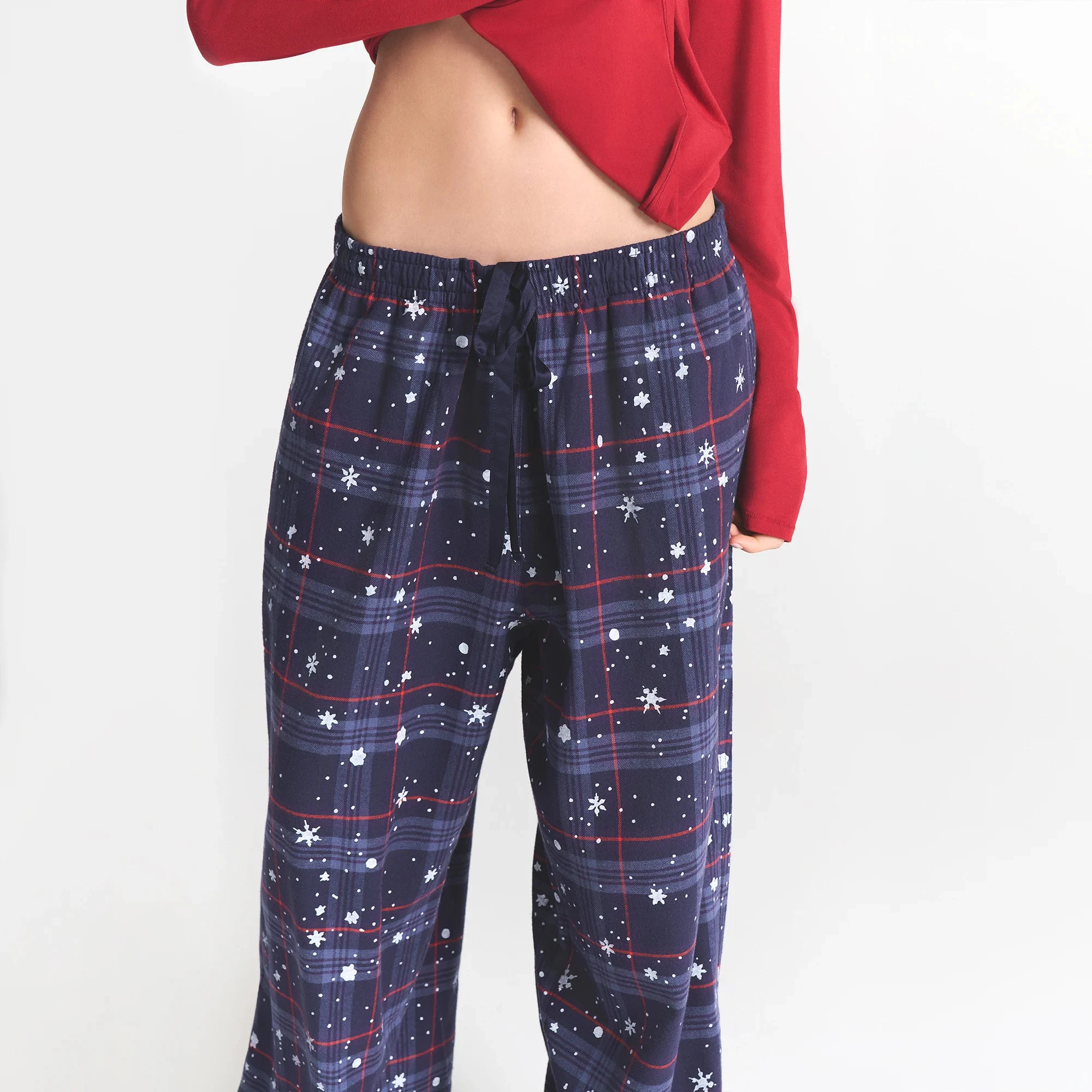 CACTUS PLANT FLEA MARKET X SKIMS SKIMS SLEEP FLANNEL PANT SET | SANTAS FAVORITE BRICK PRINT ON A MODEL FRONT VIEW @ | FOCUS: 0.0, 1.0, 0.9