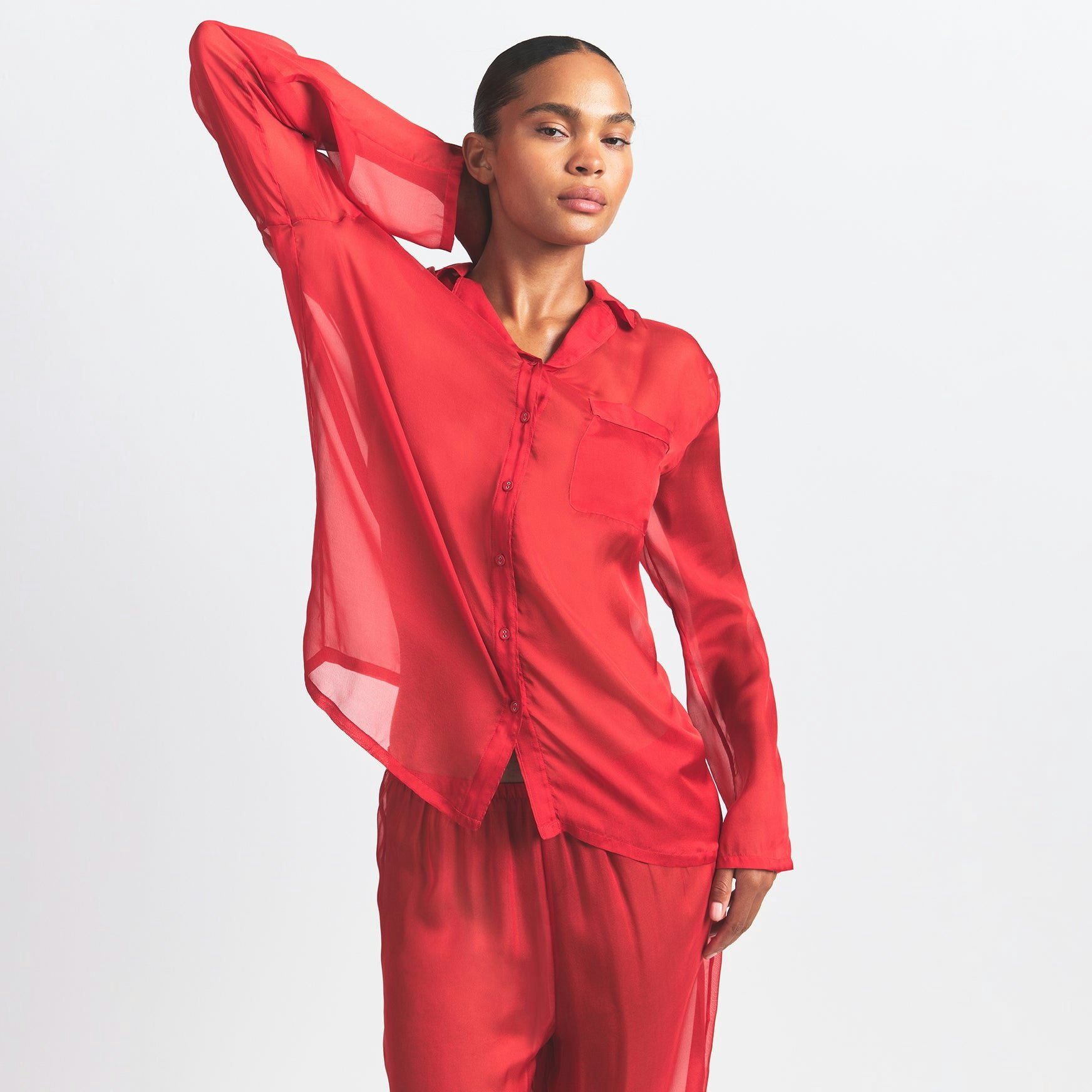 SKIMS ROMANCE BUTTON UP SHIRT AND PANT SET | CRANBERRY ON A MODEL FRONT VIEW @ | FOCUS: 0.0, 1.0, 0.9