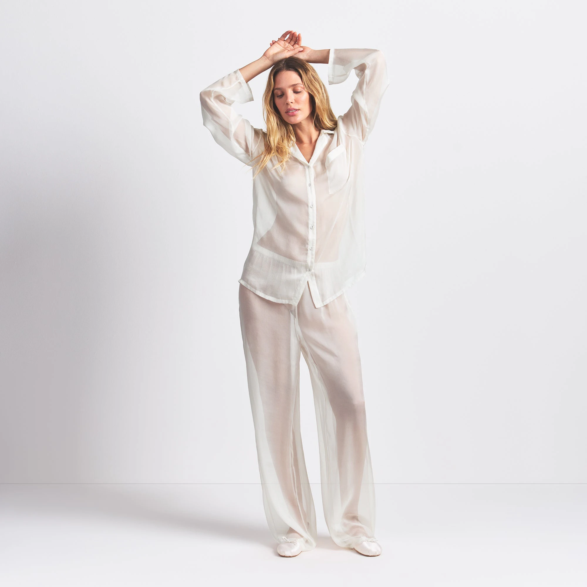 SKIMS ROMANCE BUTTON UP SHIRT AND PANT SET | ECRU ON A MODEL FRONT VIEW @ | FOCUS: 0.0, 1.0, 0.9