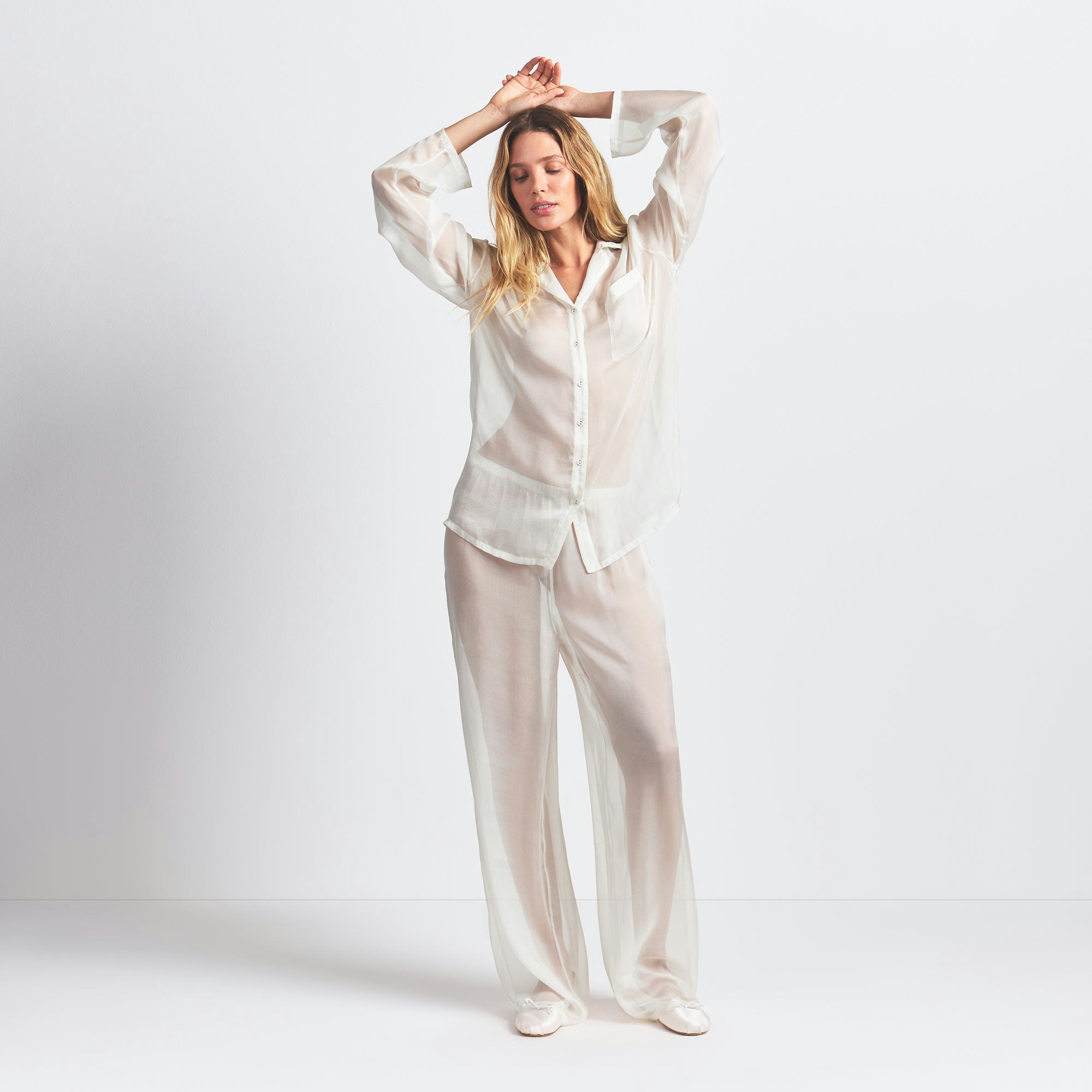 SKIMS ROMANCE BUTTON UP SHIRT AND PANT SET | ECRU ON A MODEL FRONT VIEW @ | FOCUS: 0.0, 1.0, 0.9