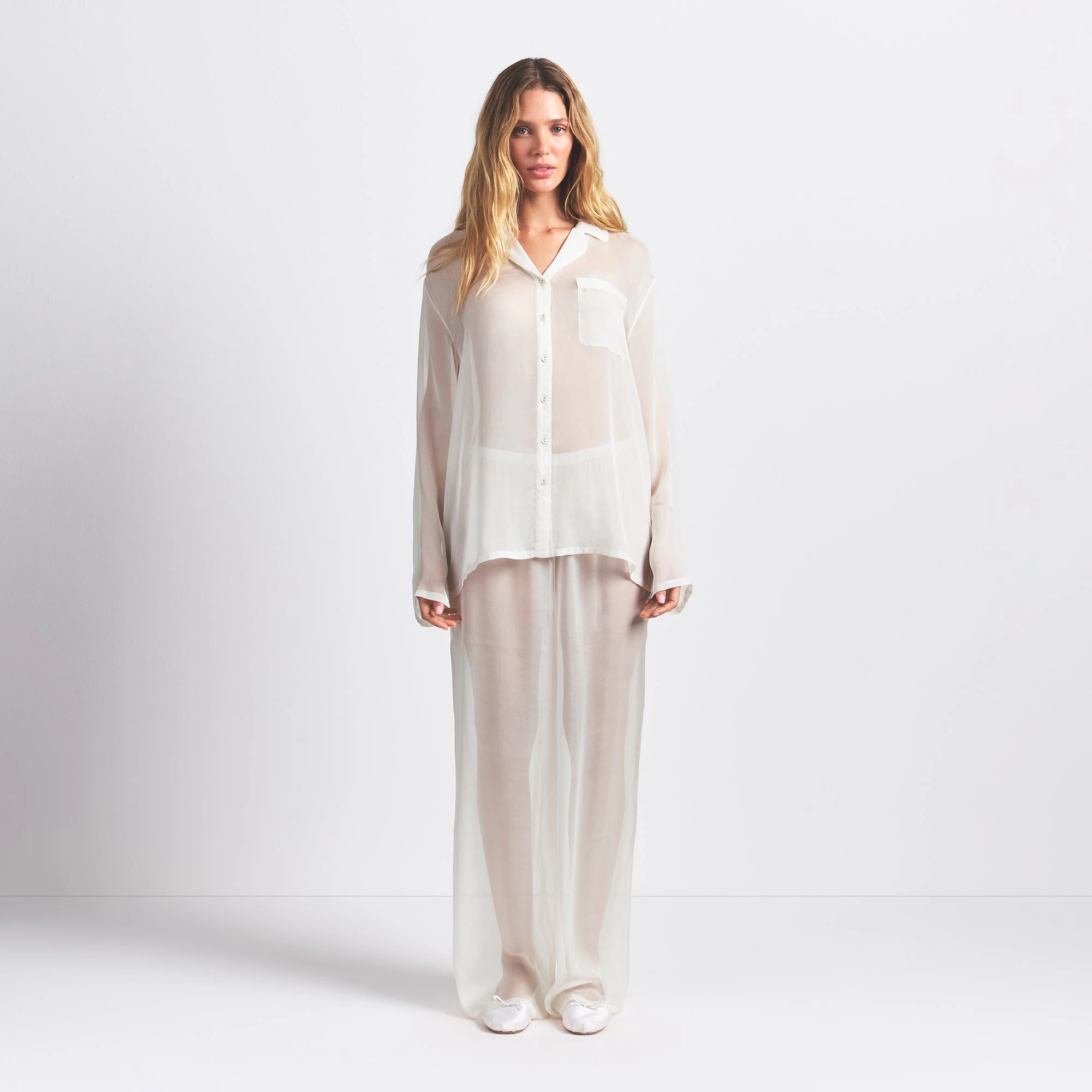 SKIMS ROMANCE BUTTON UP SHIRT AND PANT SET | ECRU ON A MODEL FRONT VIEW @ | FOCUS: 0.0, 1.0, 0.9