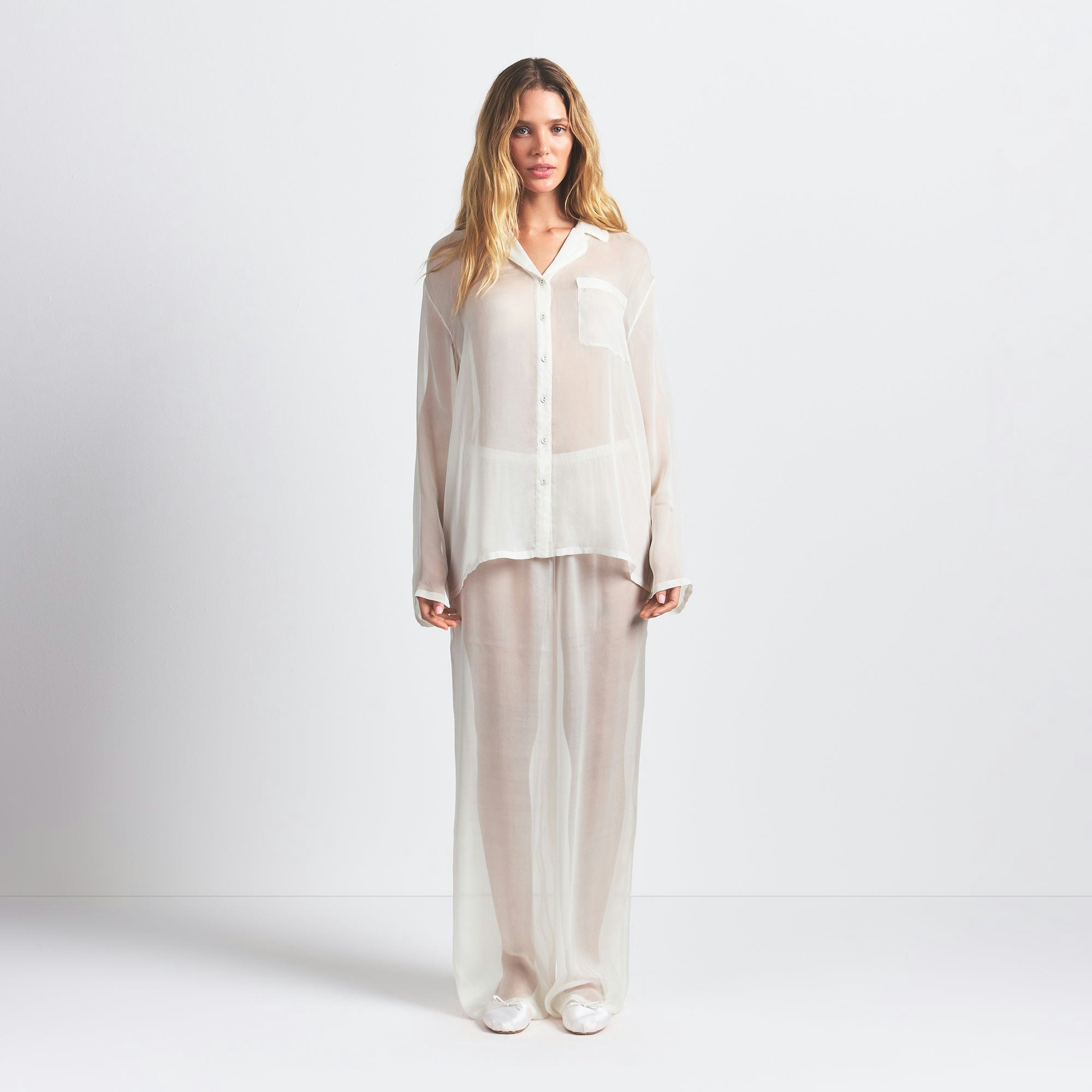 SKIMS ROMANCE BUTTON UP SHIRT AND PANT SET | ECRU ON A MODEL FRONT VIEW @ | FOCUS: 0.0, 1.0, 0.9