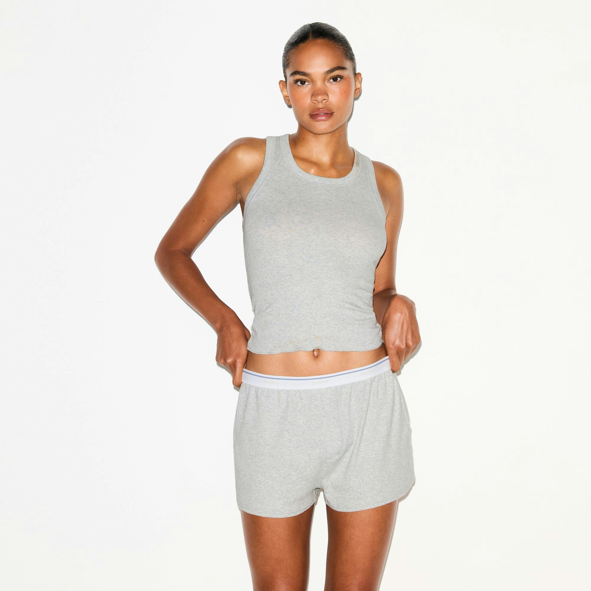 COTTON RIB SCOOP TANK AND SHORT SET | LIGHT HEATHER GREY ON A MODEL SIDE VIEW @ | FOCUS: 0.0, 1.0, 0.9