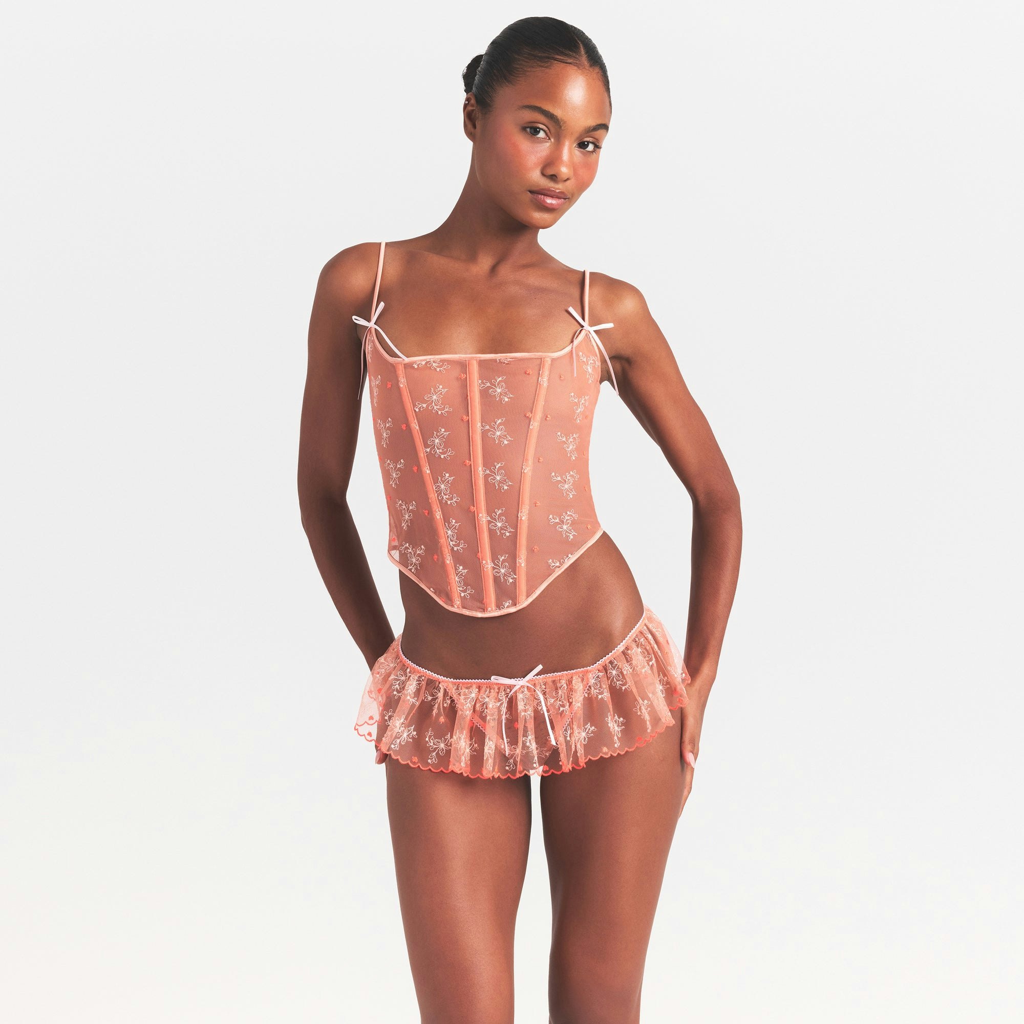 EMBROIDERED TULLE CORSET | GUAVA HEART TULLE ON A MODEL SIDE VIEW @ | FOCUS: 0.0, 1.0, 0.9