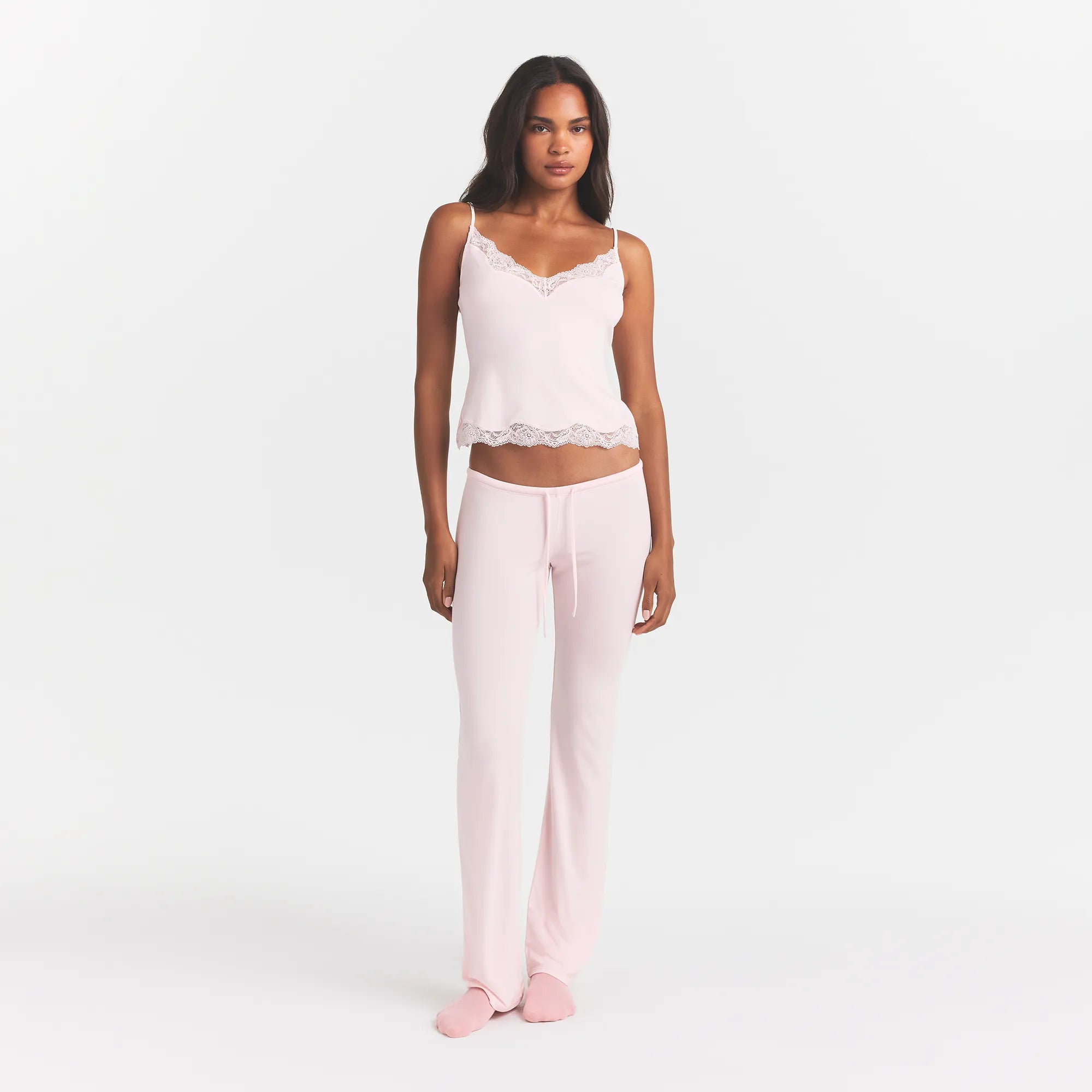 SKIMS SLEEP LACE CAMI AND PANT SET | BARELY PINK ON A MODEL FRONT VIEW @ | FOCUS: 0.0, 1.0, 0.9