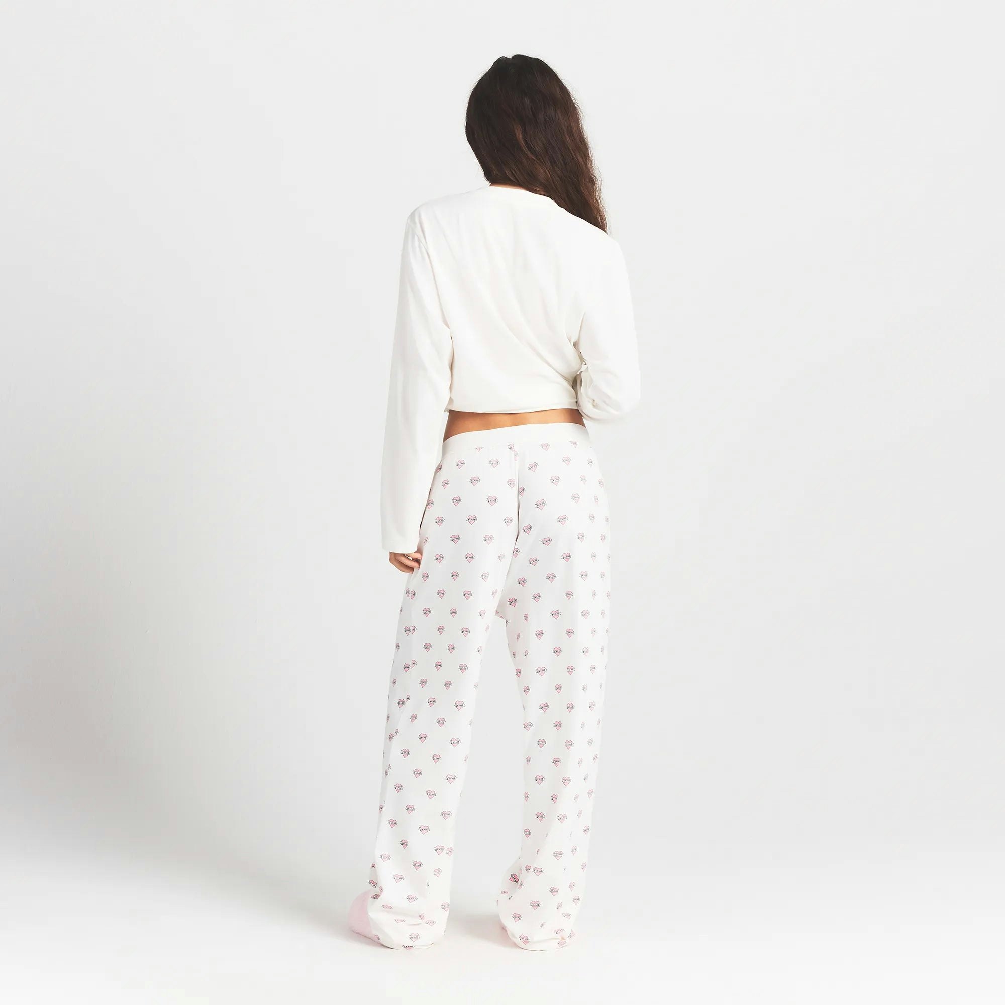 BOYFRIEND LONG SLEEVE T-SHIRT AND LOOSE PANT SET | MARBLE HEART BANNER ON A MODEL BACK VIEW @ | FOCUS: 0.0, 1.0, 0.9