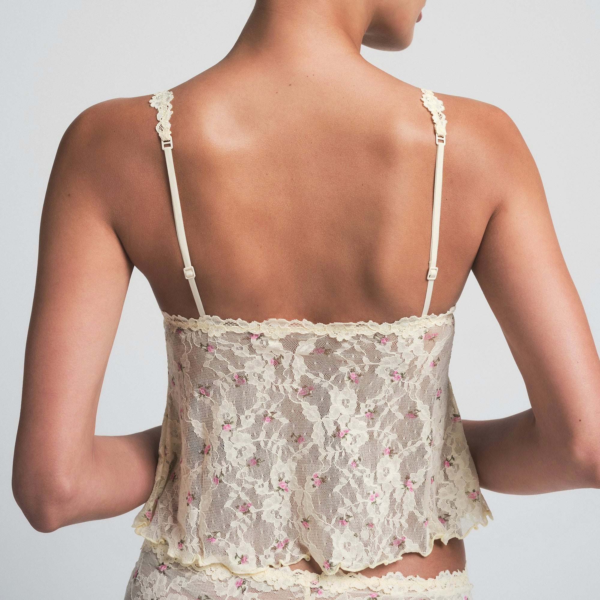 STRETCH LACE TRIANGLE CAMI AND SHORT SET | BUTTER ROSEBUD PRINT ON A MODEL SIDE VIEW | FOCUS: 0.0, 1.0, 0.9