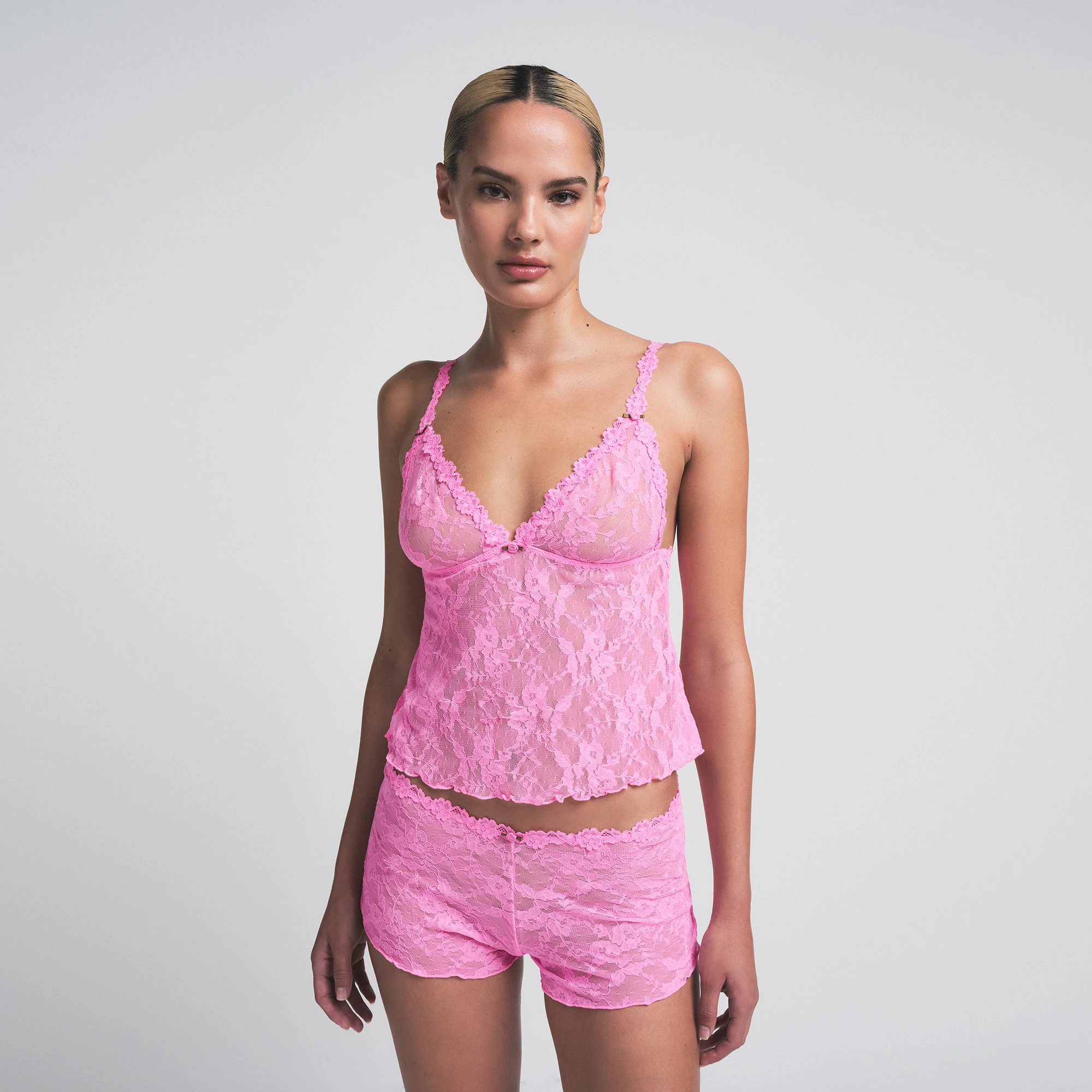 STRETCH LACE TRIANGLE CAMI AND SHORT SET | SUGAR PINK ON A MODEL SIDE VIEW | FOCUS: 0.0, 1.0, 0.9