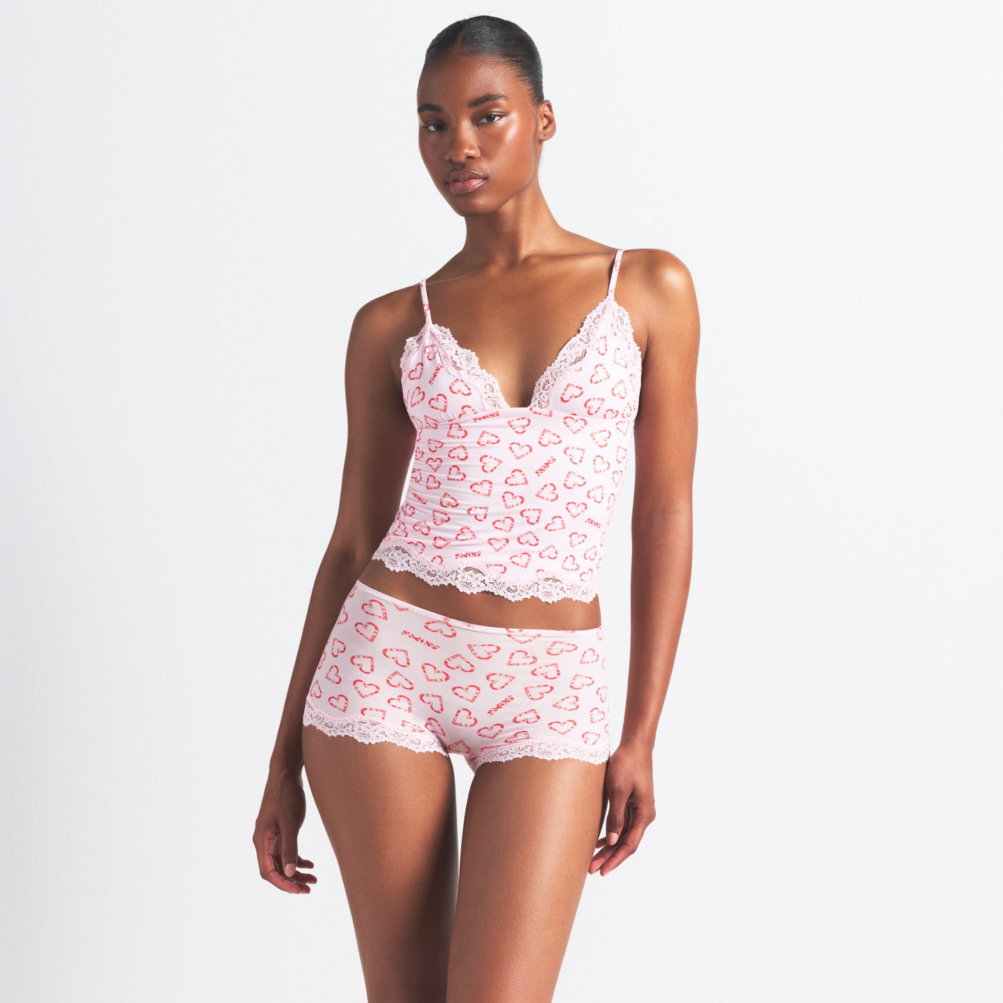 FITS EVERYBODY LACE TRIANGLE CAMI AND BOY SHORT SET | CHERRY BLOSSOM CANDY HEART PRINT ON A MODEL SIDE VIEW @ | FOCUS: 0.0, 1.0, 0.9