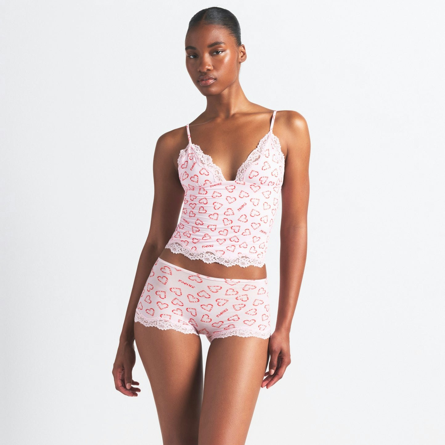 FITS EVERYBODY LACE TRIANGLE CAMI AND BOY SHORT SET | CHERRY BLOSSOM CANDY HEART PRINT ON A MODEL SIDE VIEW @ | FOCUS: 0.0, 1.0, 0.9