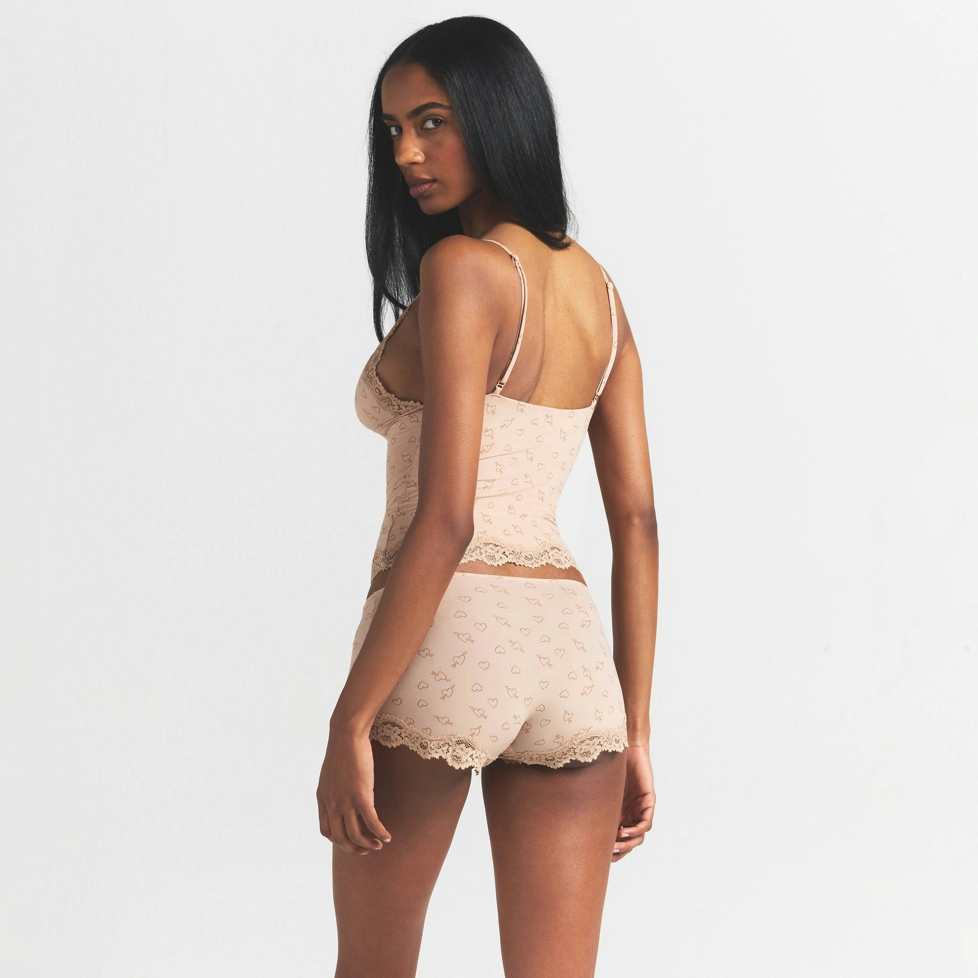 FITS EVERYBODY LACE TRIANGLE CAMI AND BOY SHORT SET | MICA SKETCHED HEARTS ON A MODEL SIDE VIEW @ | FOCUS: 0.0, 1.0, 0.9