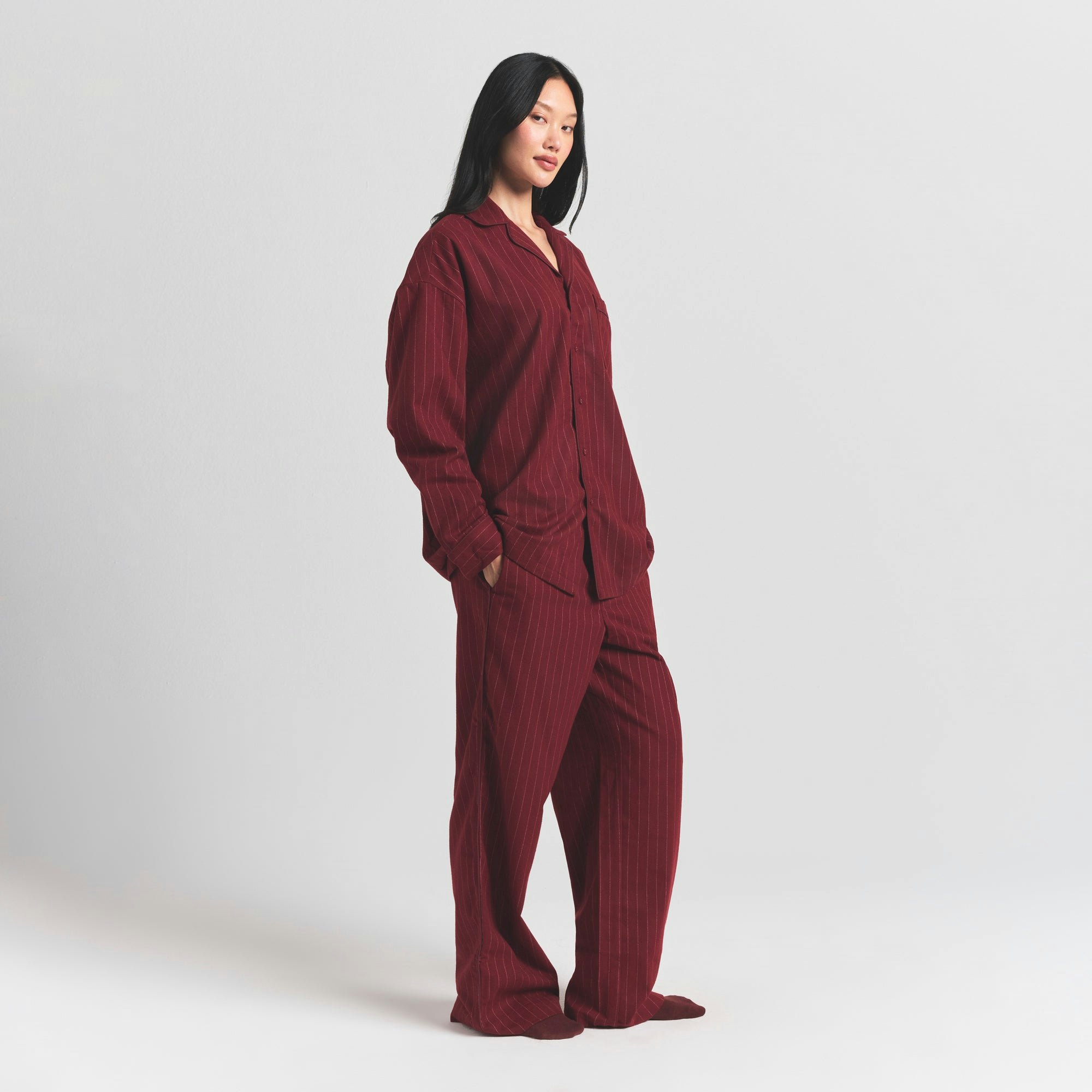 HEAVY FLANNEL SLEEP SET | MERLOT STRIPE ON A MODEL SIDE VIEW ON A MODEL FRONT VIEW @ | FOCUS: 0.0, 1.0, 0.9