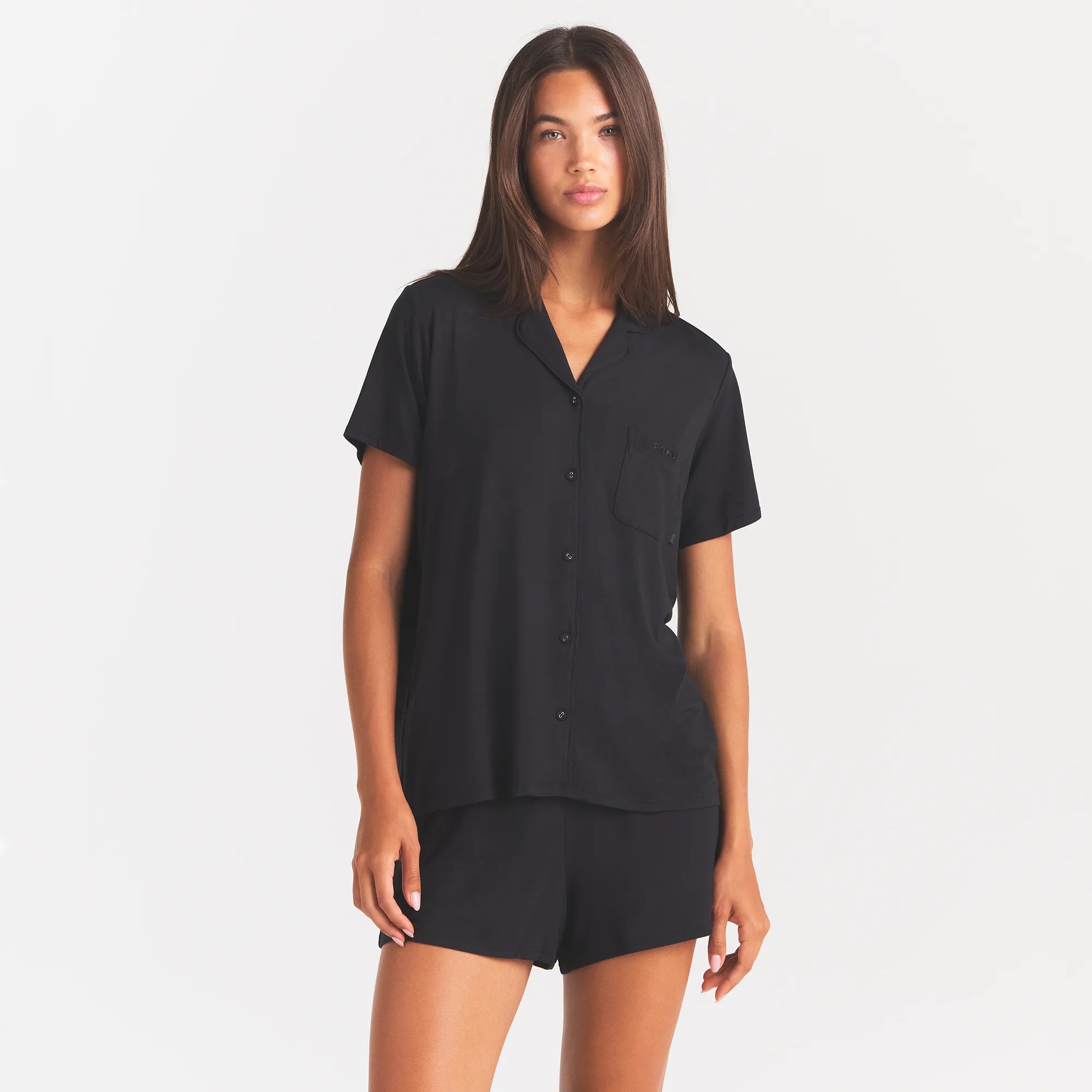 SKIMS SLEEP SHORT SLEEVE BUTTON UP SET | ONYX ON A MODEL FRONT VIEW