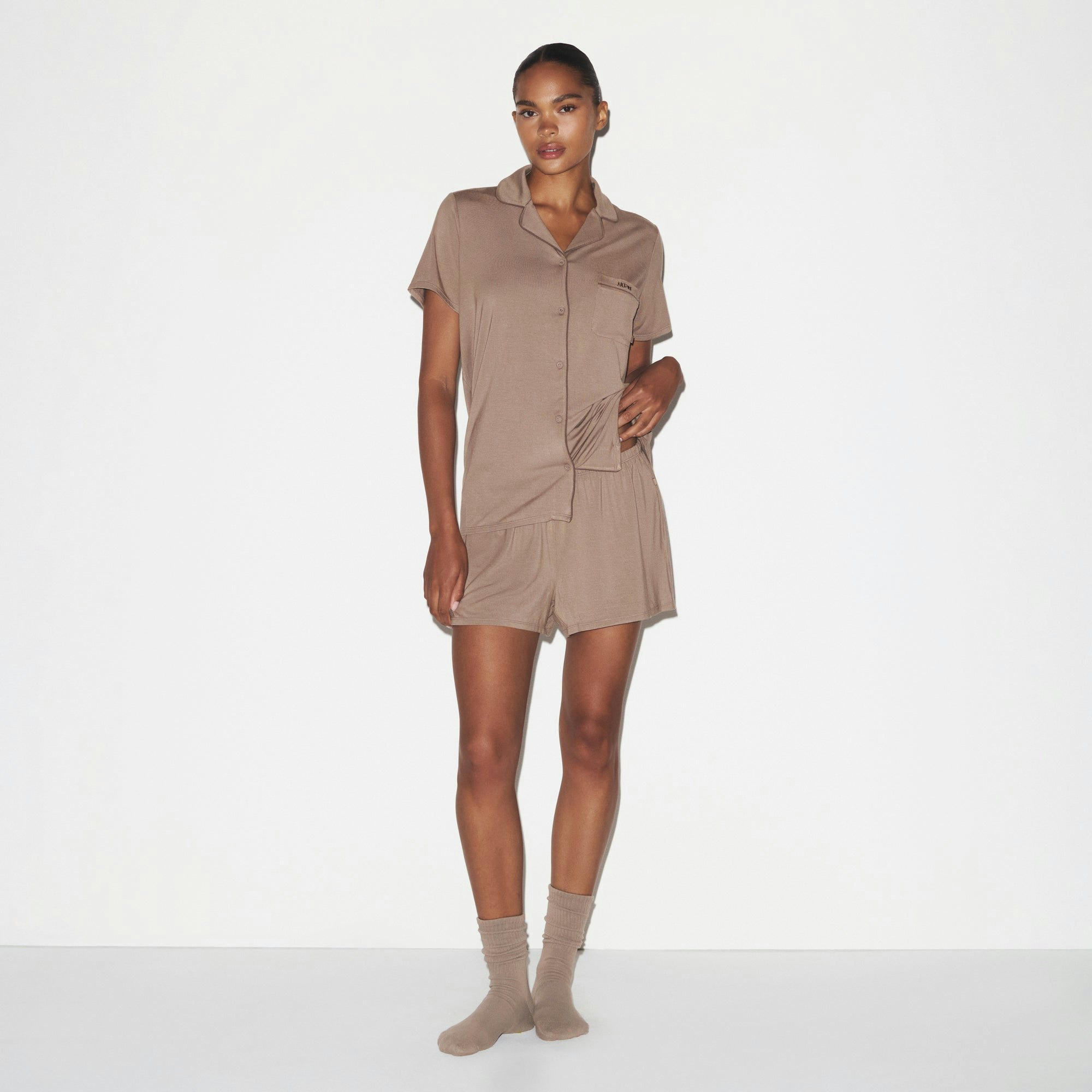 SKIMS SLEEP SHORT SLEEVE BUTTON UP SET | FOSSIL ON A MODEL FRONT VIEW @ | FOCUS: 0.0, 1.0, 0.9