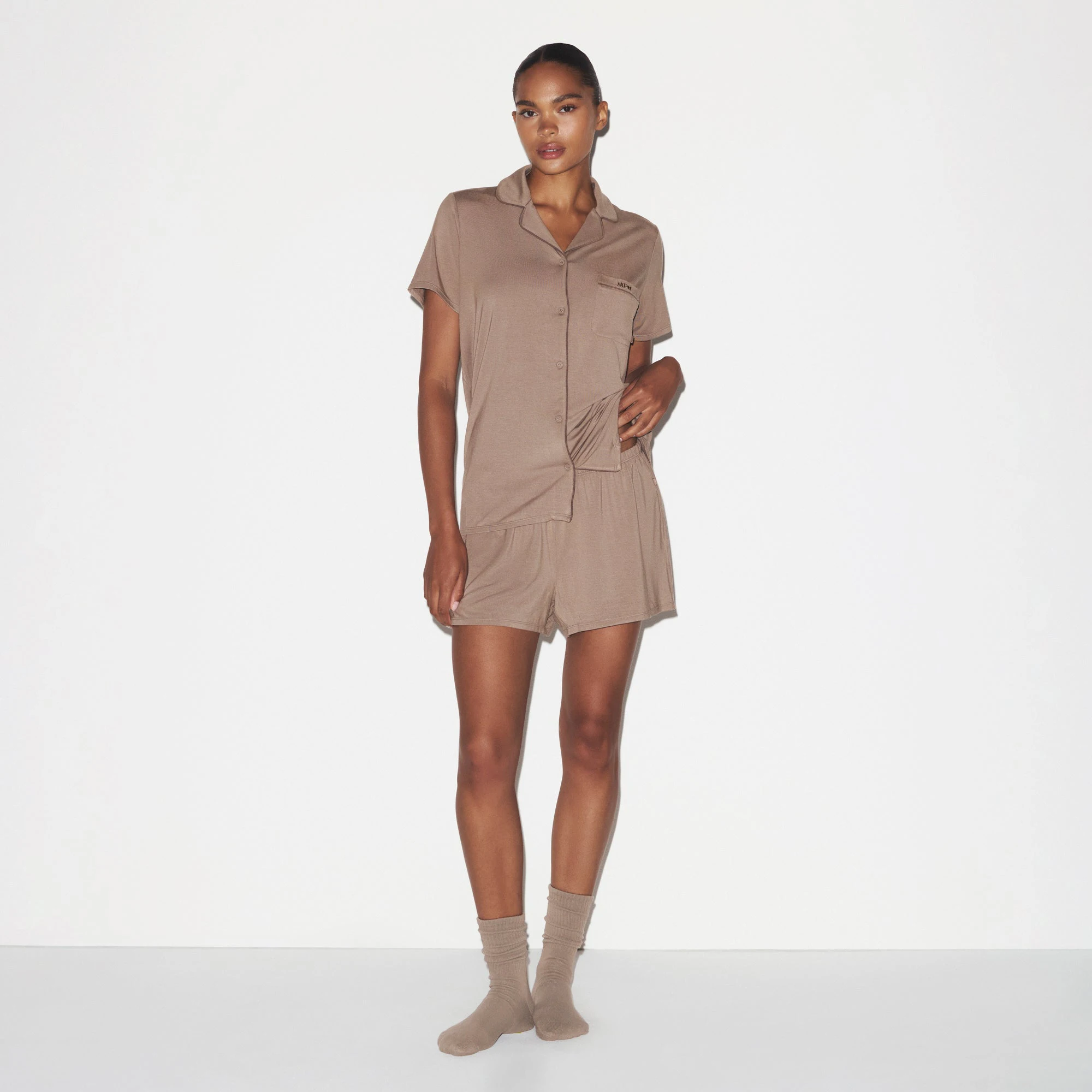 SKIMS SLEEP SHORT SLEEVE BUTTON UP SET | FOSSIL ON A MODEL FRONT VIEW @ | FOCUS: 0.0, 1.0, 0.9
