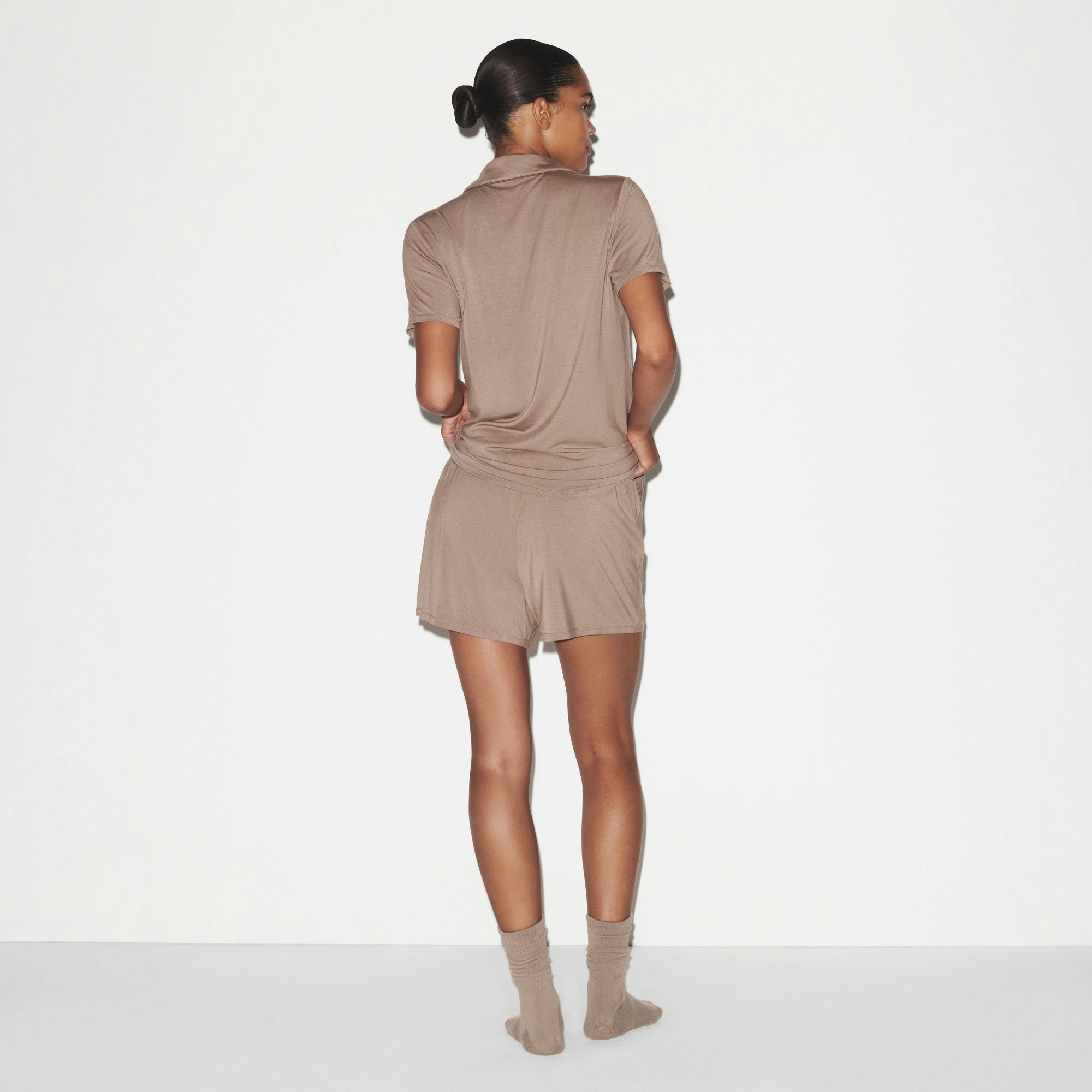 SKIMS SLEEP SHORT SLEEVE BUTTON UP SET | FOSSIL ON A MODEL SIDE VIEW @ | FOCUS: 0.0, 1.0, 0.9