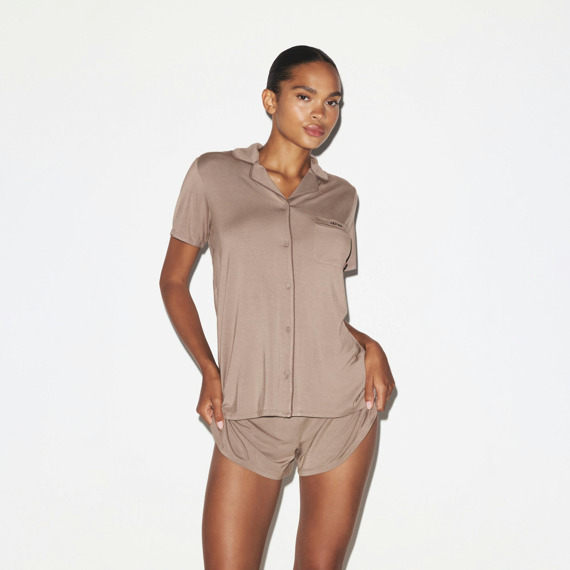 SKIMS SLEEP SHORT SLEEVE BUTTON UP SET | FOSSIL ON A MODEL SIDE VIEW @ | FOCUS: 0.0, 1.0, 0.9