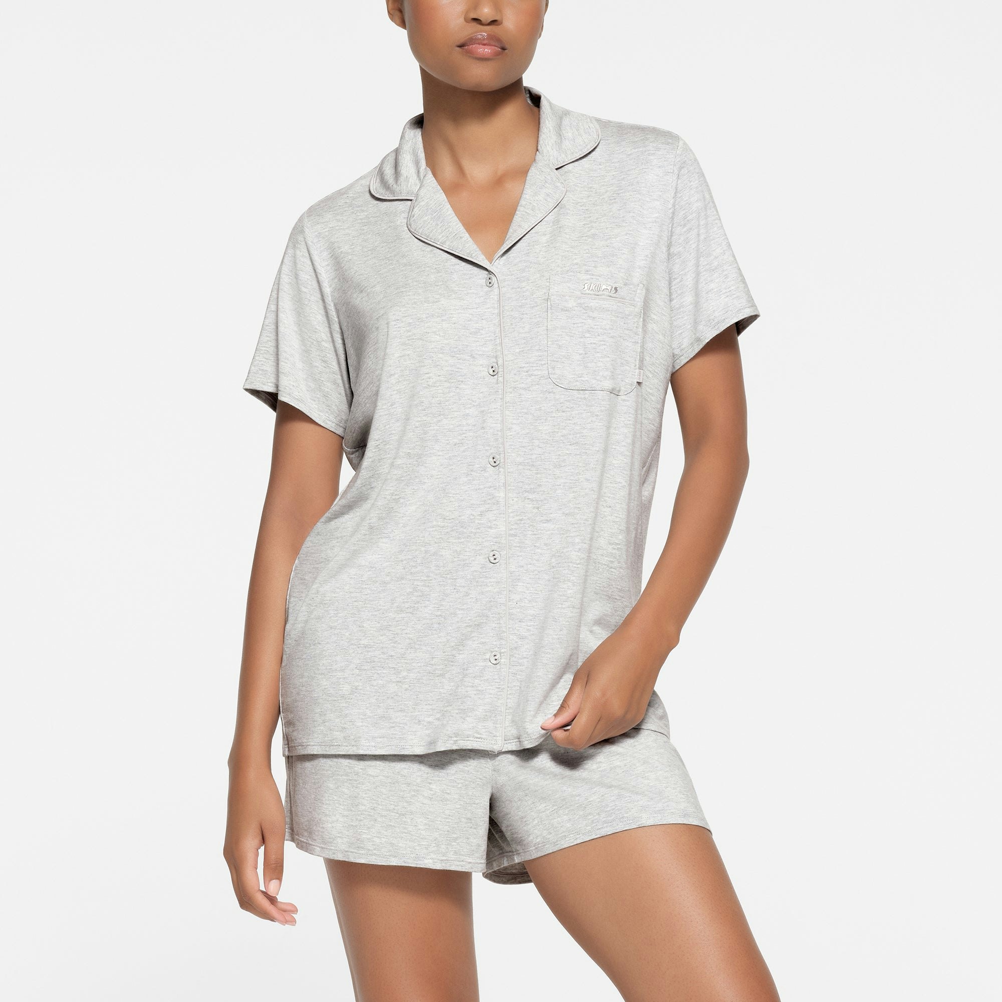 SKIMS SLEEP SHORT SLEEVE BUTTON UP SET | LIGHT HEATHER GREY ON A MODEL FRONT VIEW