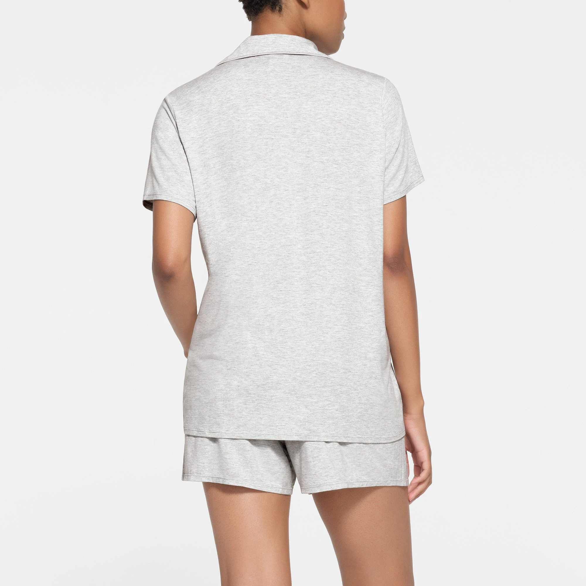 SKIMS SLEEP SHORT SLEEVE BUTTON UP SET | LIGHT HEATHER GREY ON A MODEL BACK VIEW