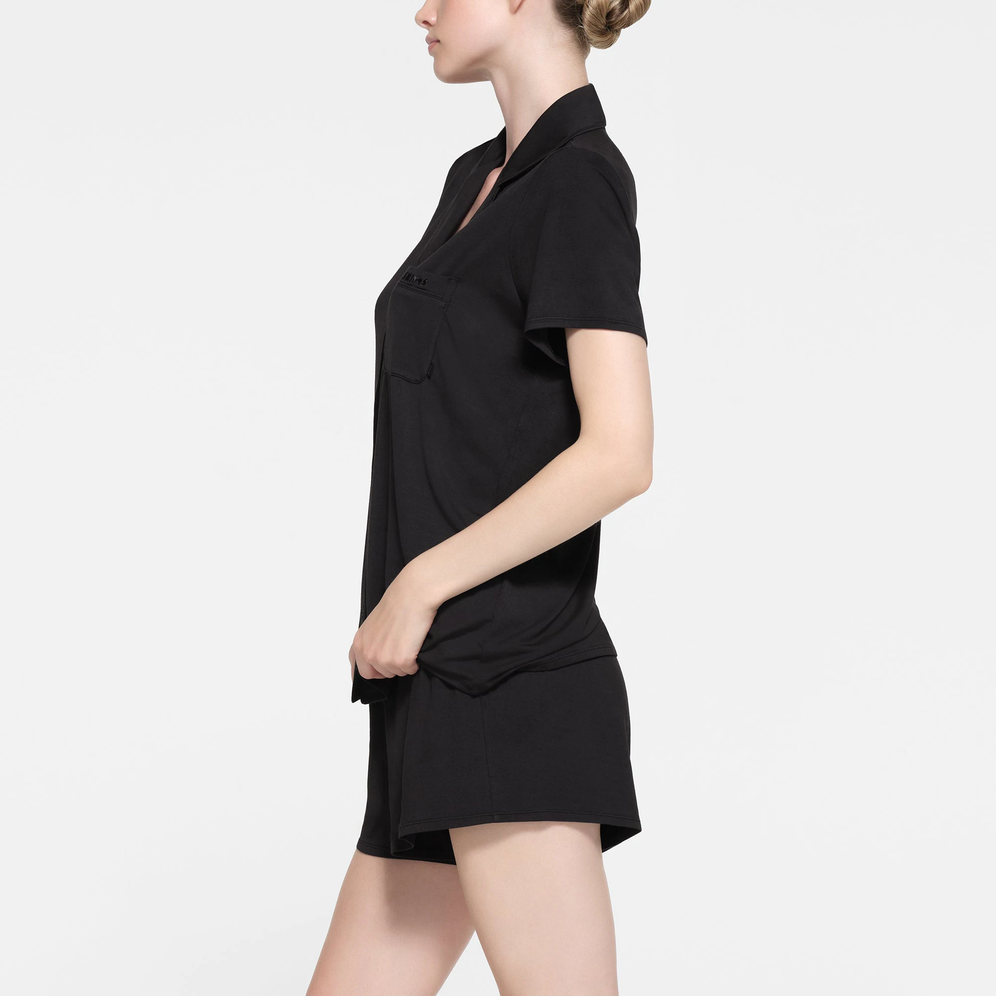 SKIMS SLEEP SHORT SLEEVE BUTTON UP SET | ONYX ON A MODEL SIDE VIEW
