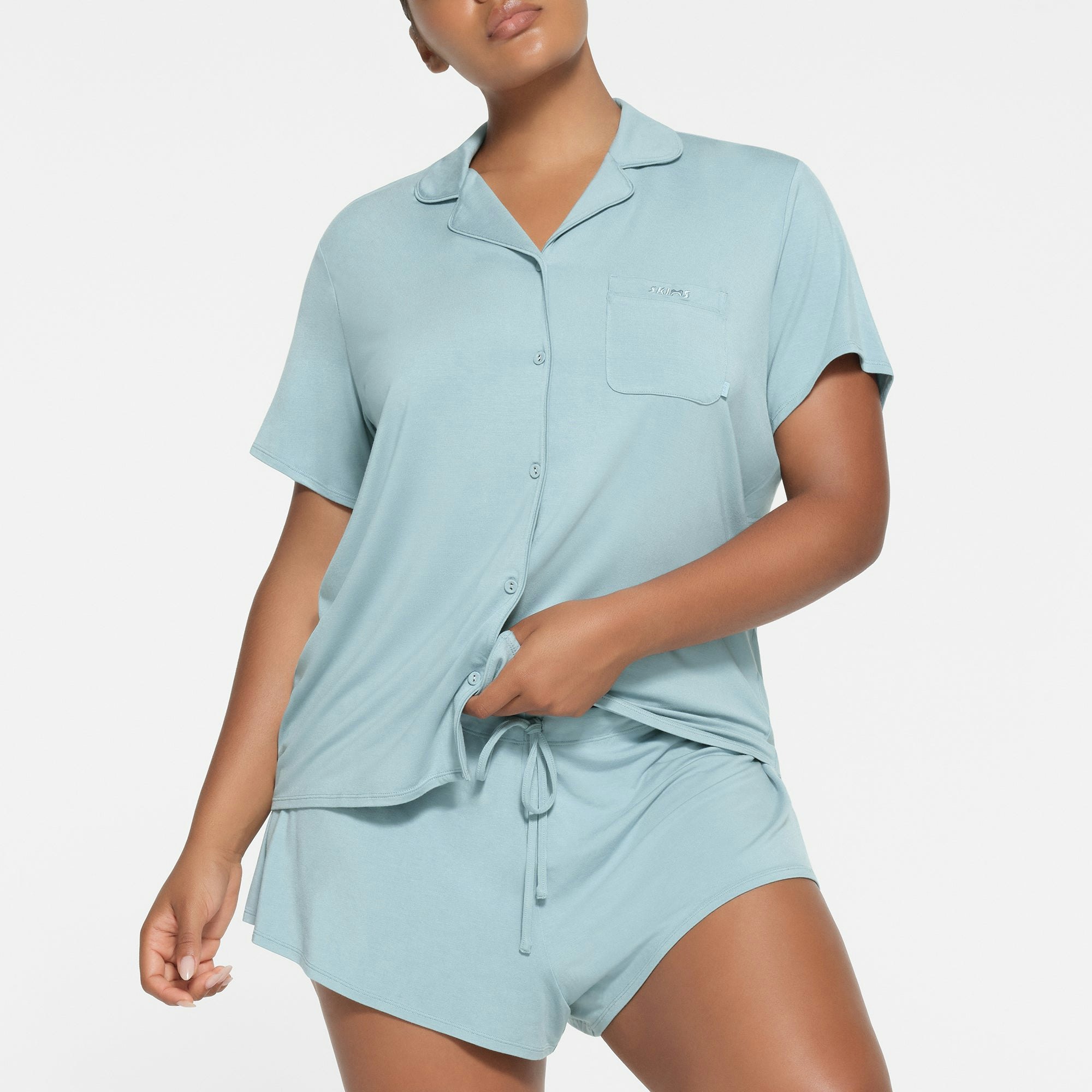 SKIMS SLEEP SHORT SLEEVE BUTTON UP SET | SKY ON A MODEL FRONT VIEW