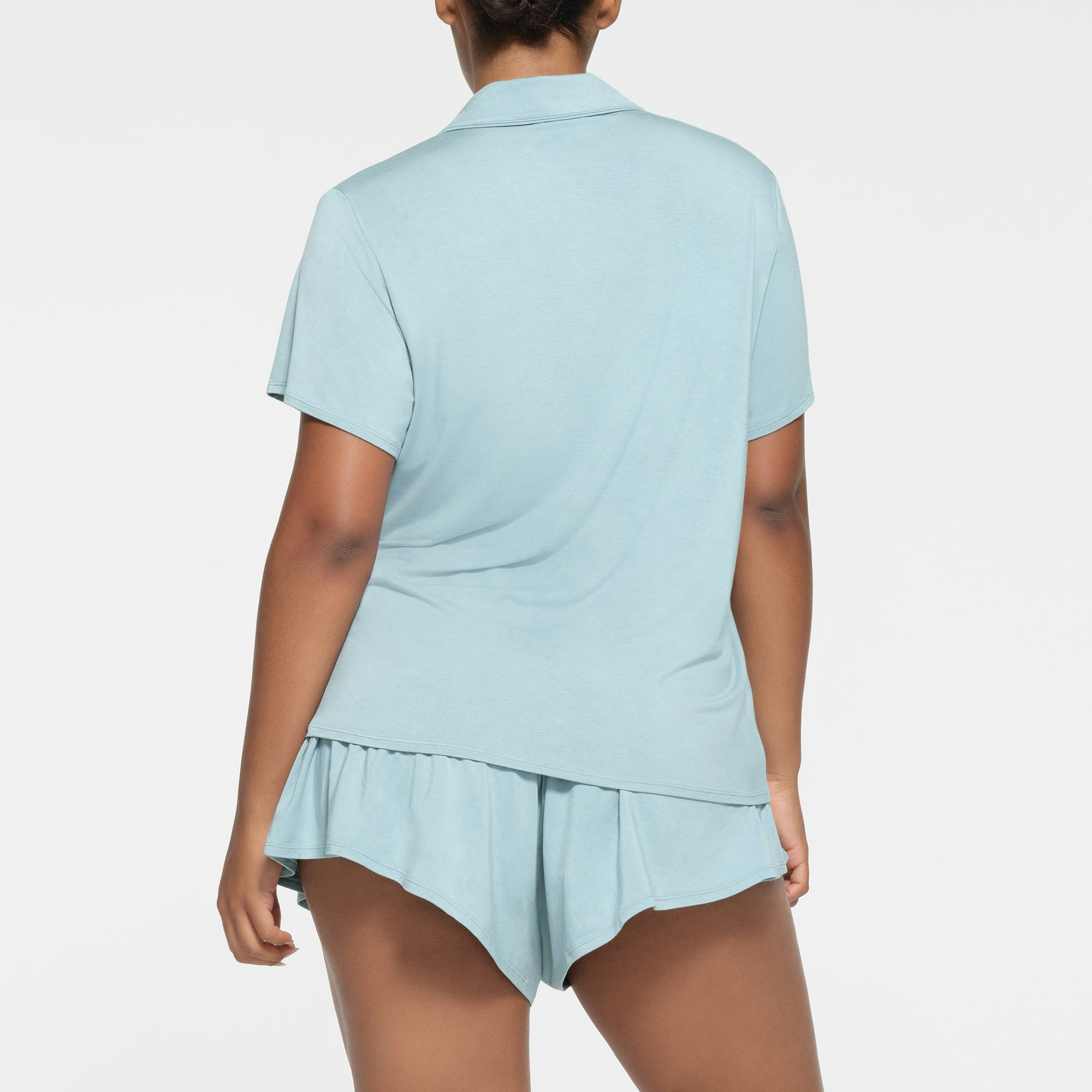 SKIMS SLEEP SHORT SLEEVE BUTTON UP SET | SKY ON A MODEL BACK VIEW