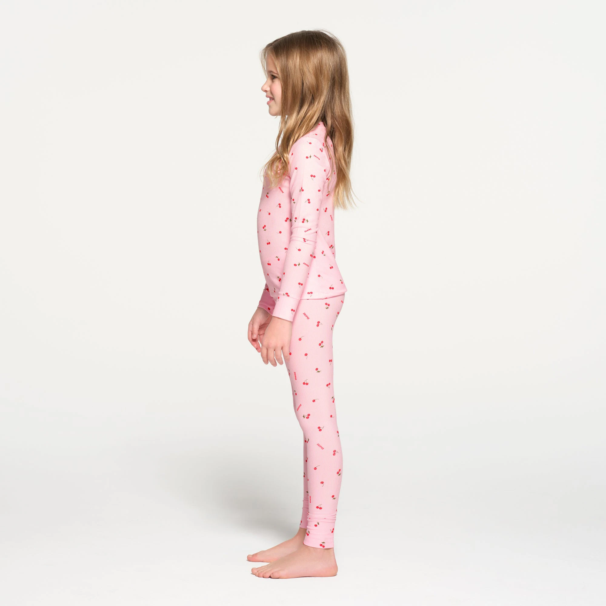 SOFT LOUNGE KIDS SLEEP SET | CHERRY BLOSSOM CHERRY PRINT ON A MODEL SIDE VIEW
