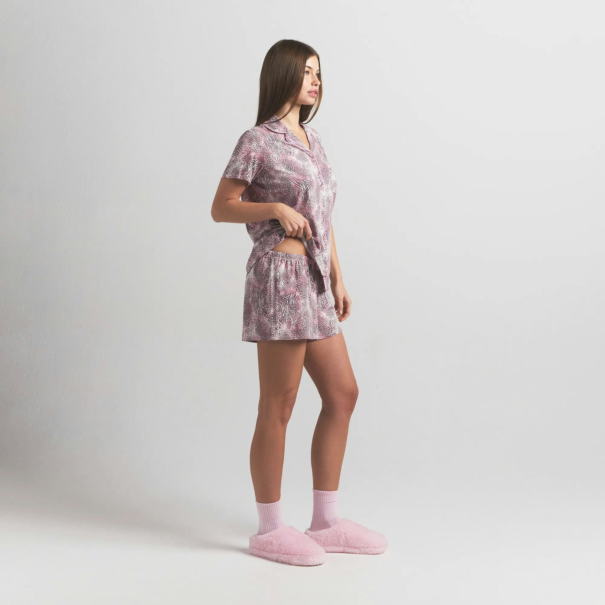 SKIMS SLEEP SHORT SLEEVE BUTTON UP SET | BLOOM MINI MULTI ANIMAL ON A MODEL SIDE VIEW @ | FOCUS: 0.0, 1.0, 0.9