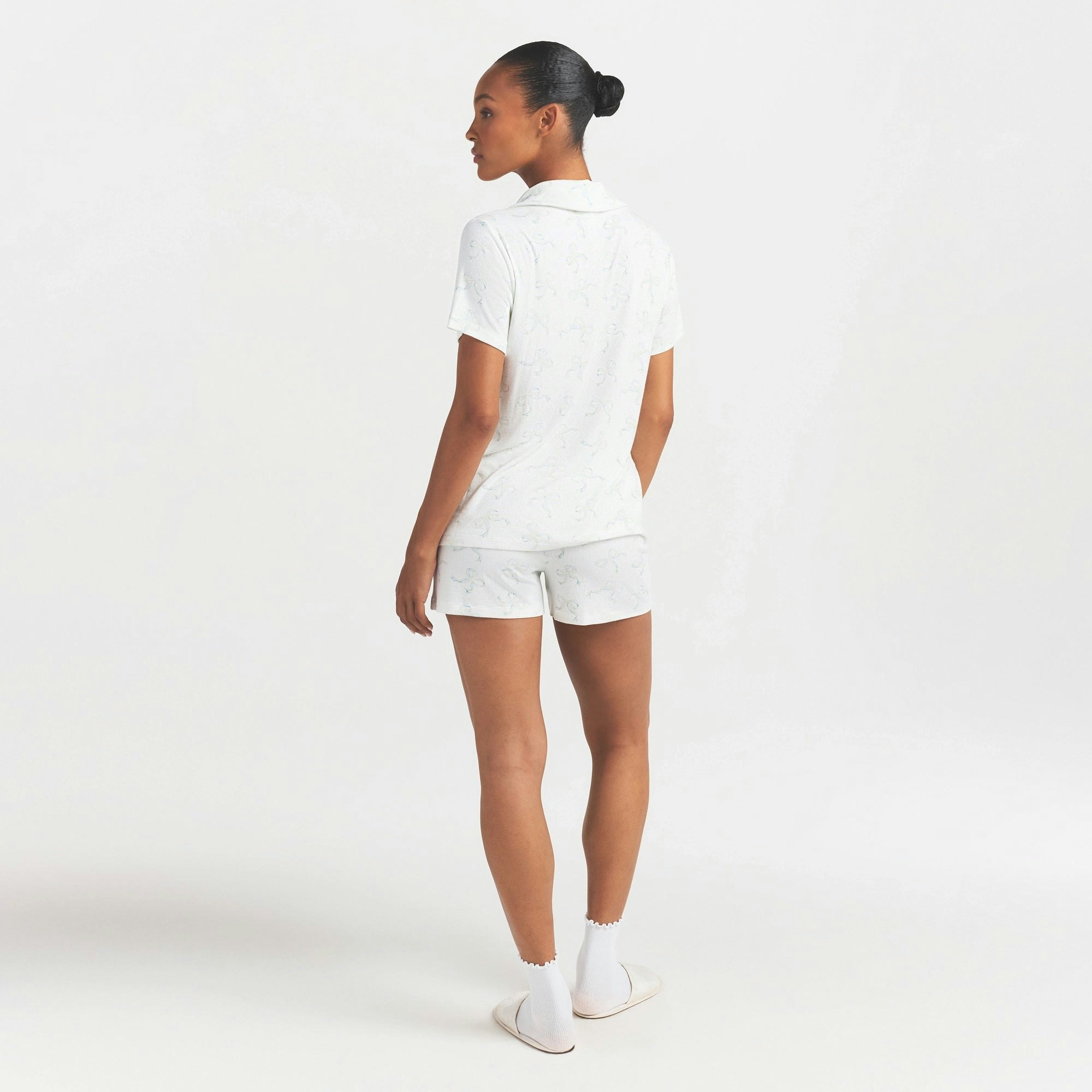 SOFT LOUNGE SHORT SLEEP SET | IVORY PEARL BOWS PRINT ON A MODEL FRONT VIEW @ | FOCUS: 0.0, 1.0, 0.9