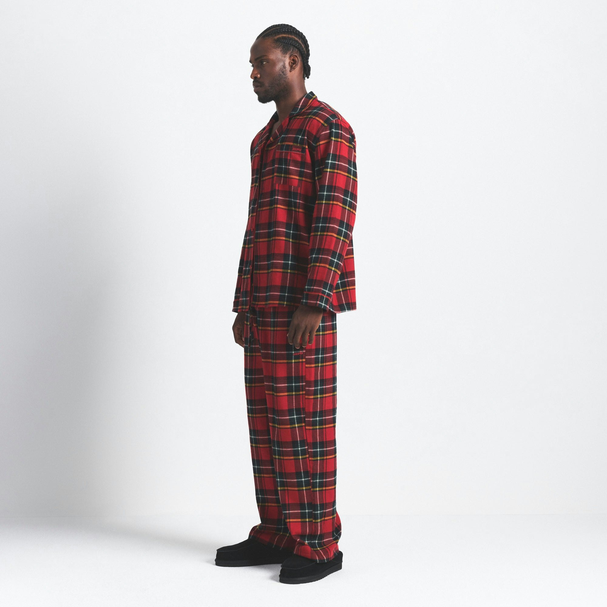 FLANNEL SLEEP MENS SLEEP SET | RED HOLIDAY PLAID ON A MODEL SIDE VIEW @ | FOCUS: 0.0, 1.0, 0.9