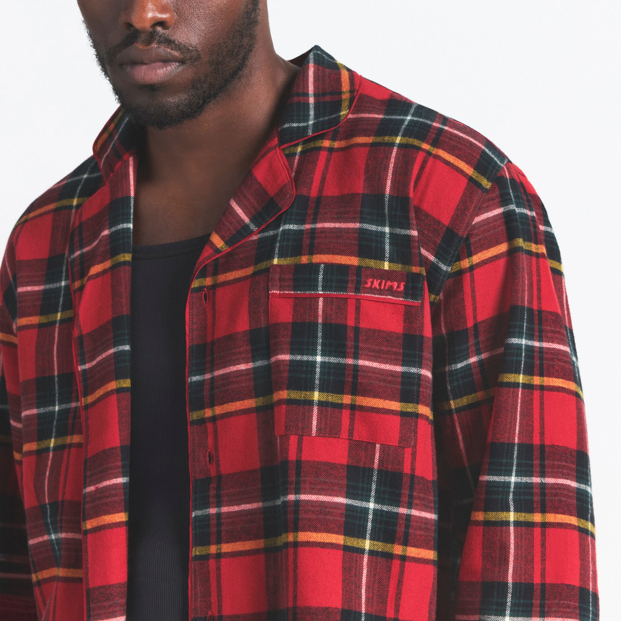 FLANNEL SLEEP MENS SLEEP SET | RED HOLIDAY PLAID ON A MODEL SIDE VIEW @ | FOCUS: 0.0, 1.0, 0.9