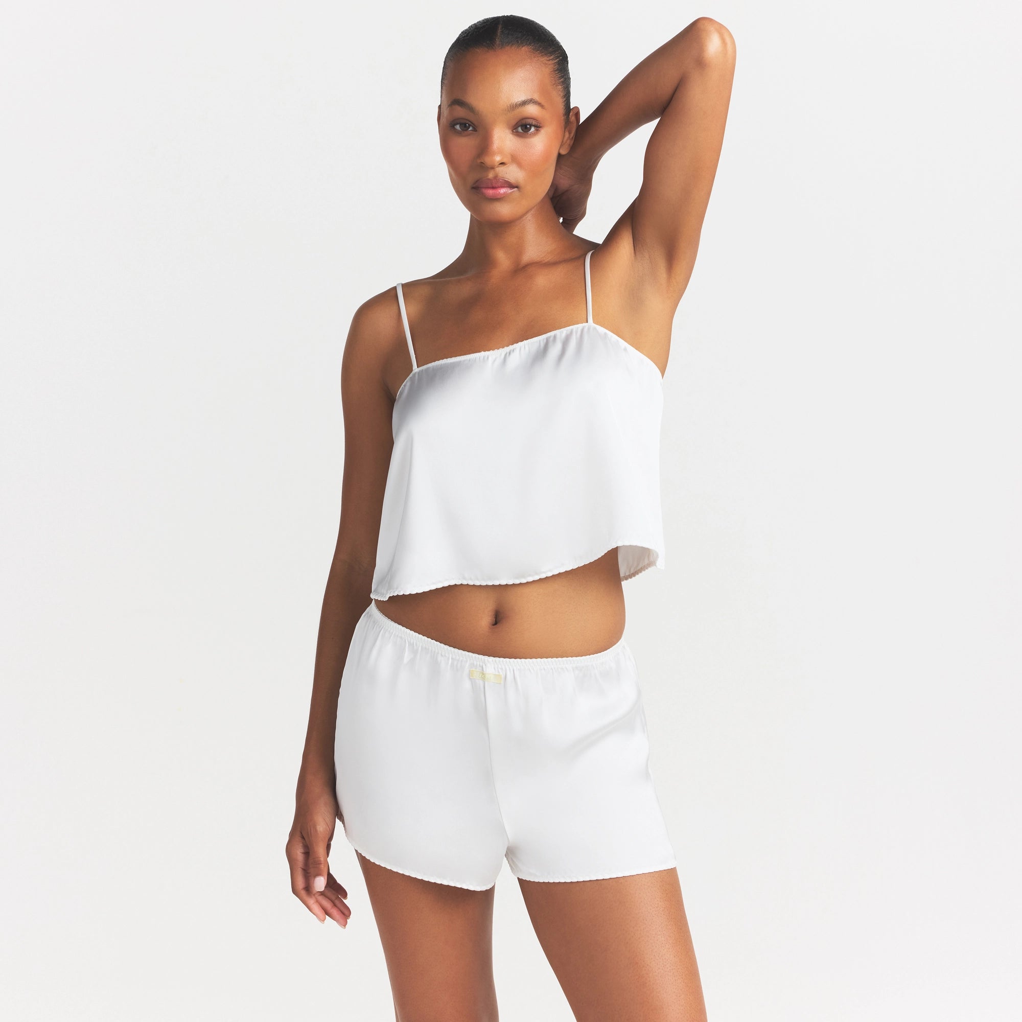 WOVEN SHINE CAMI AND SHORT SLEEP SET | IVORY ON A MODEL SIDE VIEW @ | FOCUS: 0.0, 1.0, 0.9