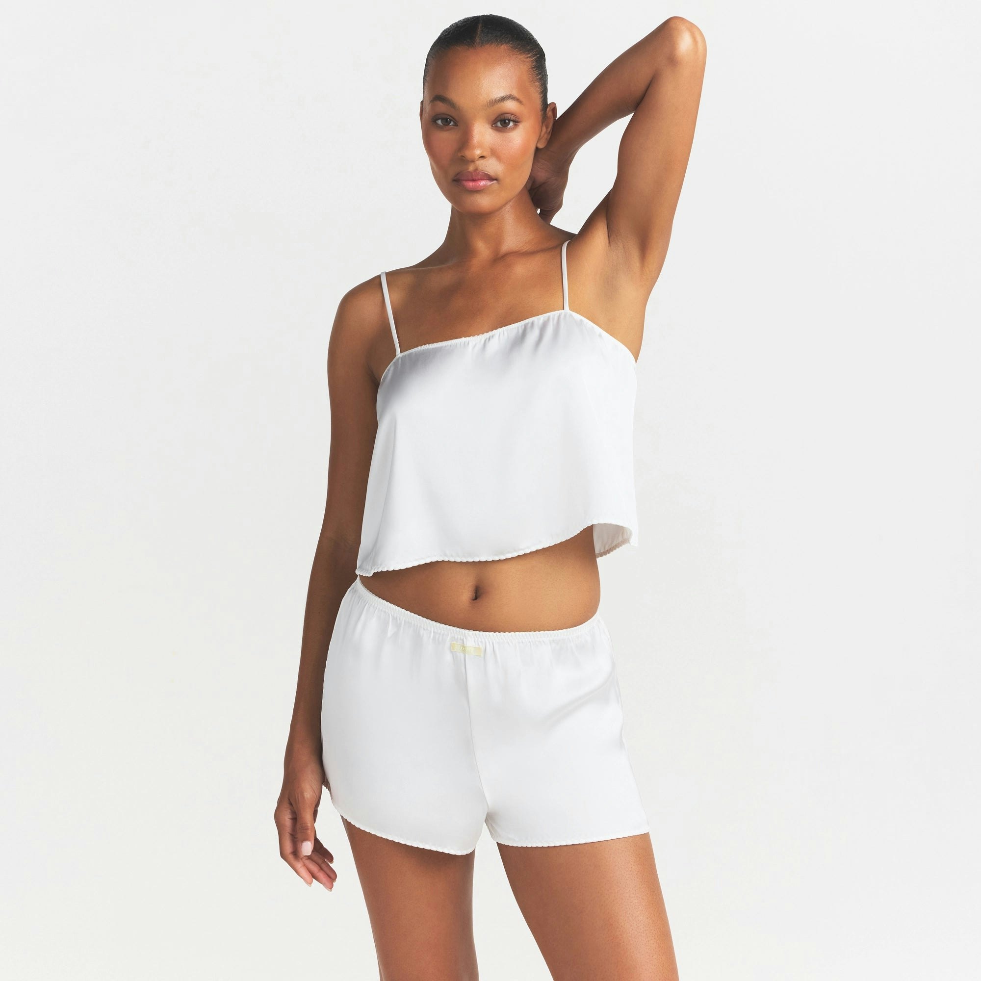 WOVEN SHINE CAMI AND SHORT SLEEP SET | IVORY ON A MODEL SIDE VIEW @ | FOCUS: 0.0, 1.0, 0.9
