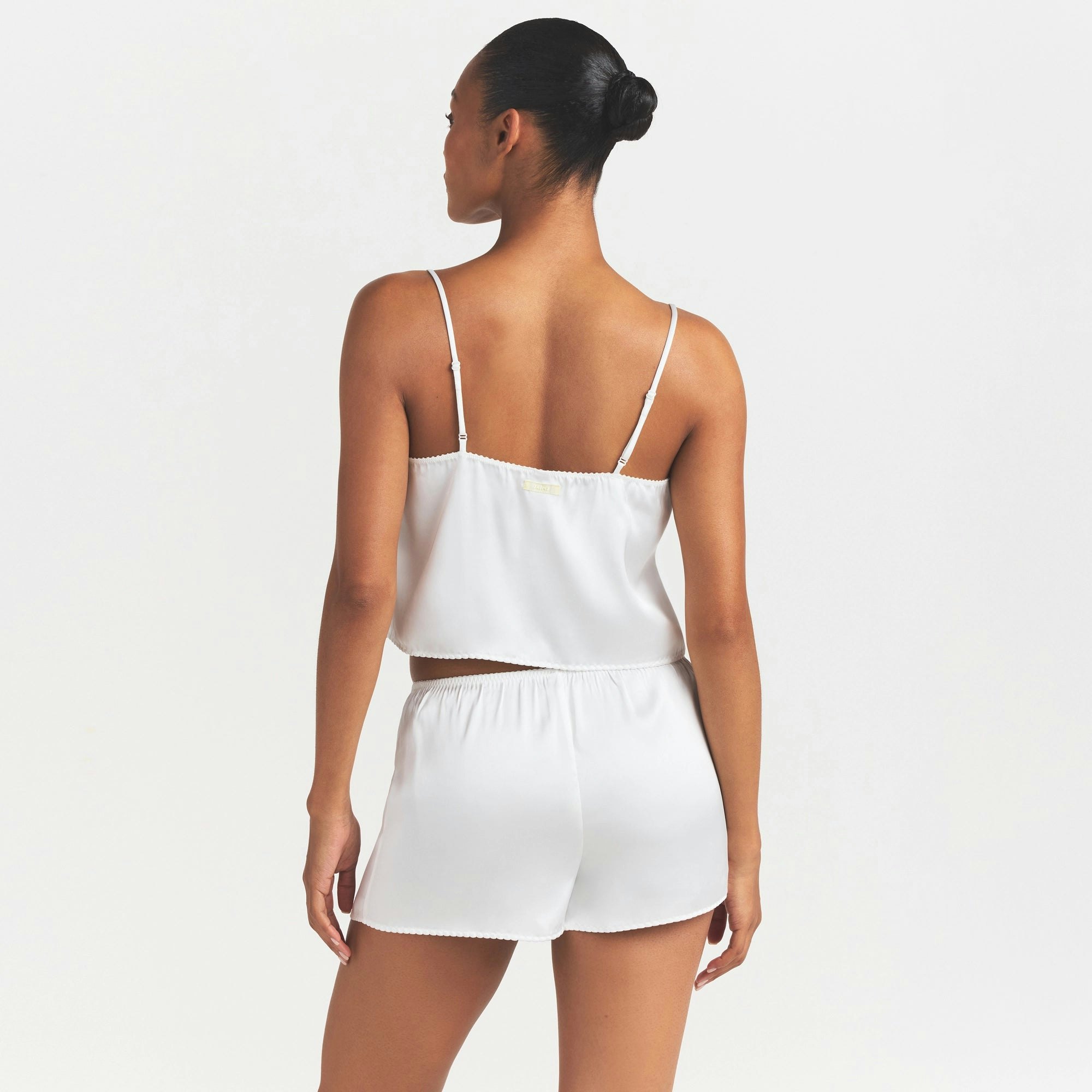 WOVEN SHINE CAMI AND SHORT SLEEP SET | IVORY ON A MODEL SIDE VIEW @ | FOCUS: 0.0, 1.0, 0.9
