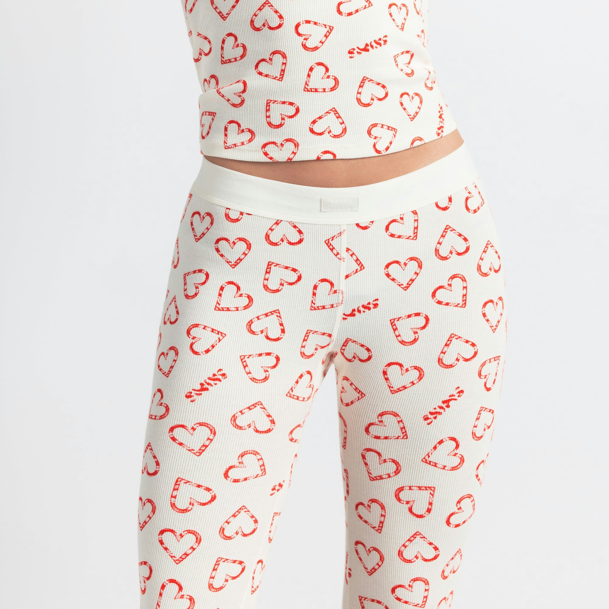COTTON RIB HENLEY AND LEGGING SET | MARBLE CANDY HEART PRINT ON A MODEL SIDE VIEW @ | FOCUS: 0.0, 1.0, 0.9