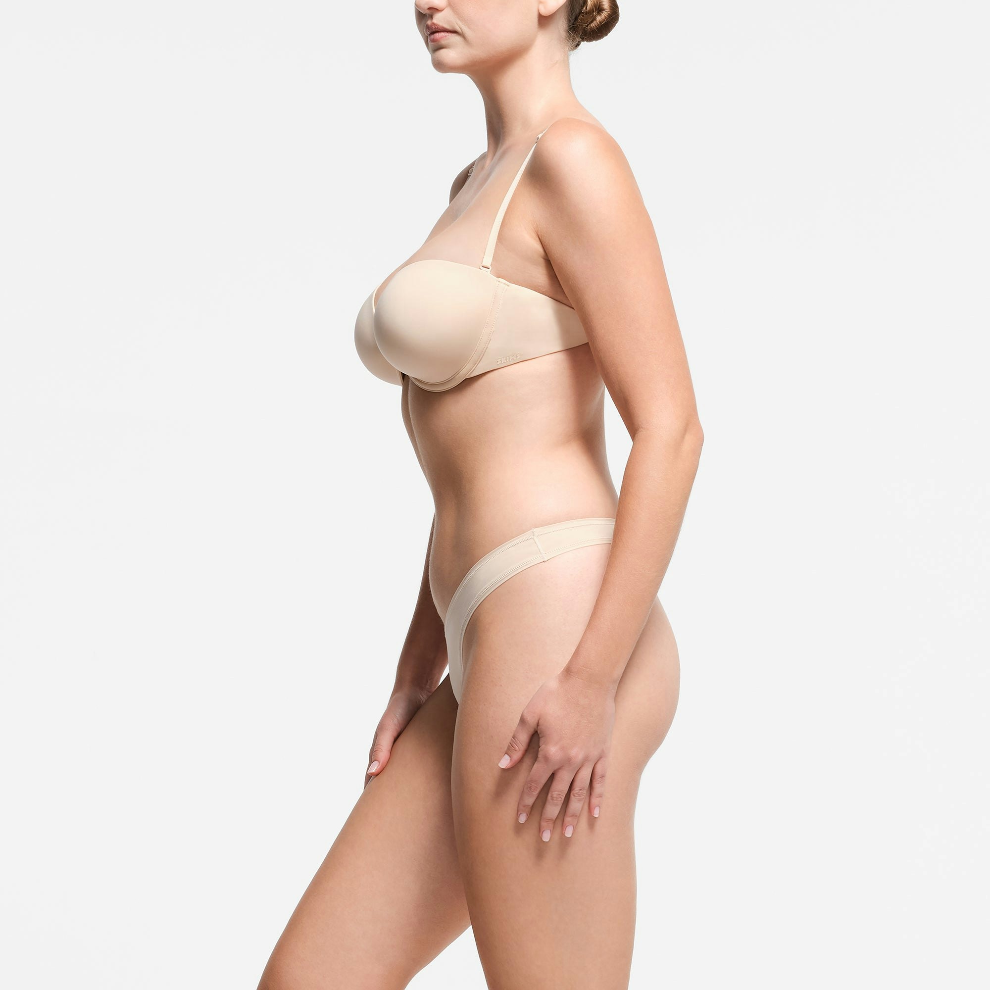 MULTI-WAY BRA | SAND ON A MODEL SIDE VIEW