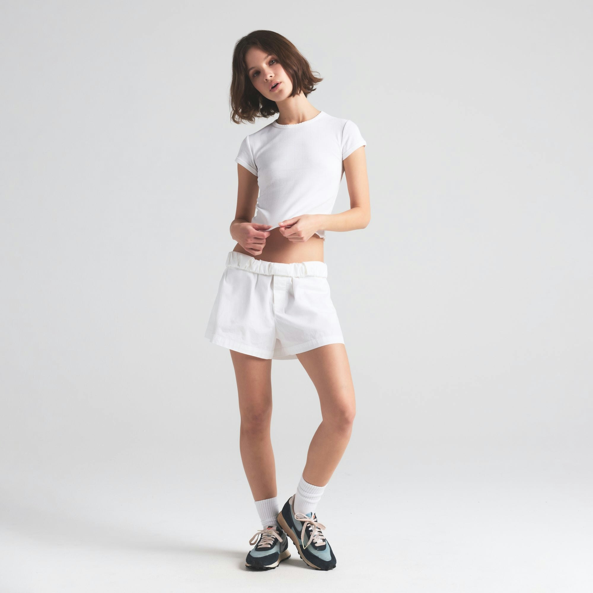 DROP NEEDLE POINTELLE BABY TEE | SNOW ON A MODEL FRONT VIEW | FOCUS: 0.0, 1.0, 0.9