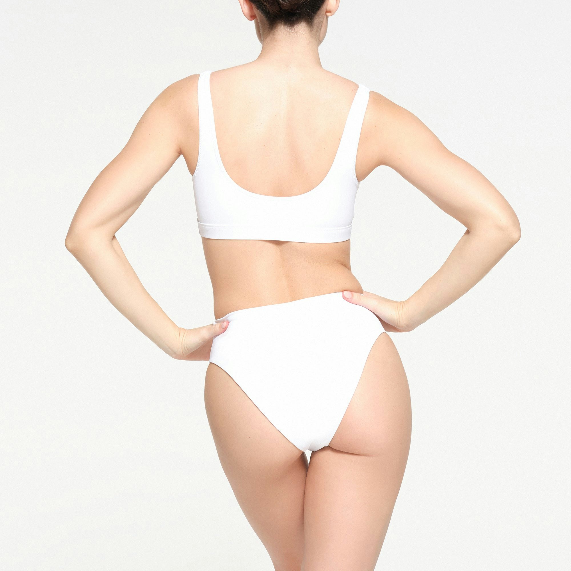 SIGNATURE SWIM MID WAIST BOTTOMS | SNOW ON A MODEL BACK VIEW