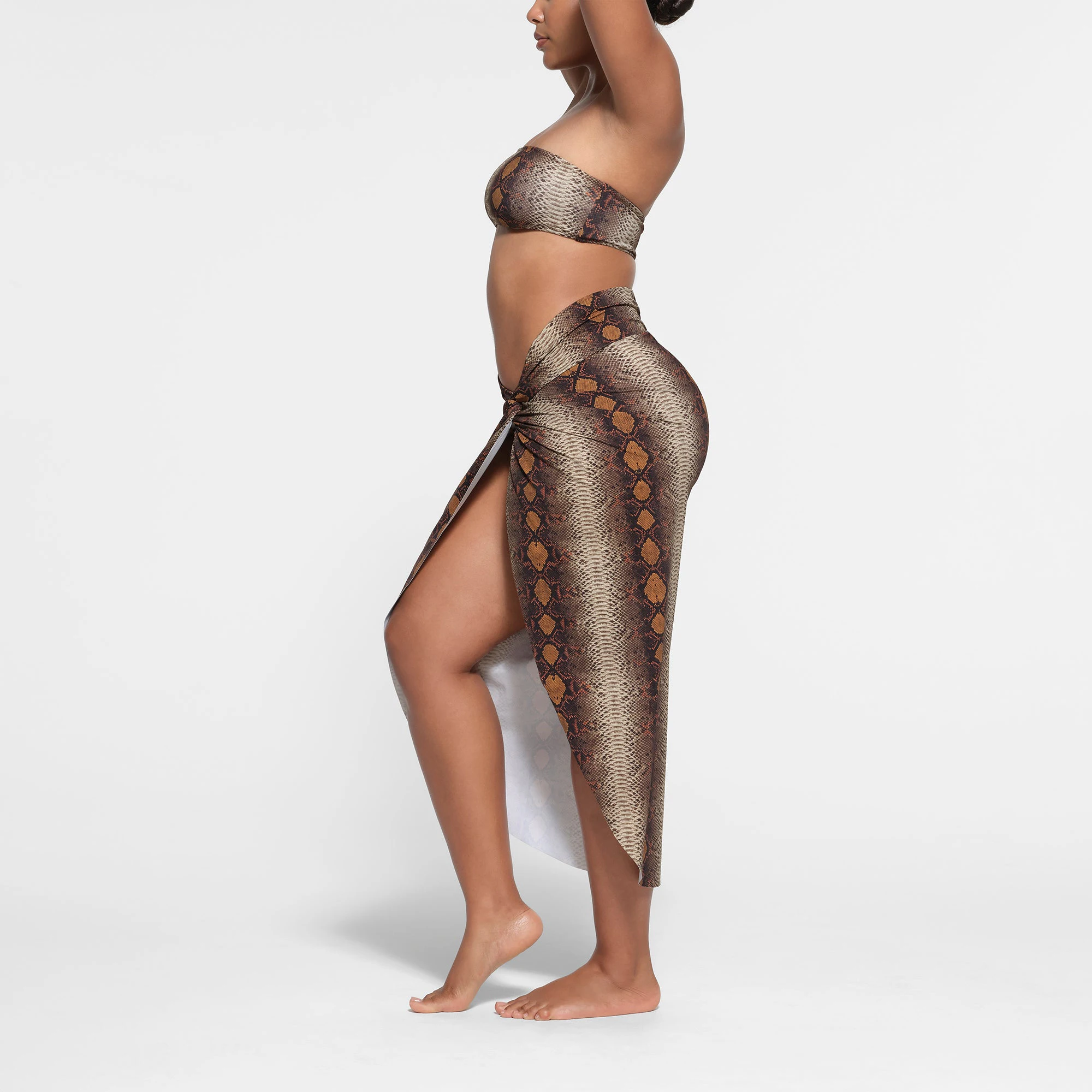 SIGNATURE SWIM SARONG SKIRT | DESERT SNAKE PRINT ON A MODEL SIDE VIEW