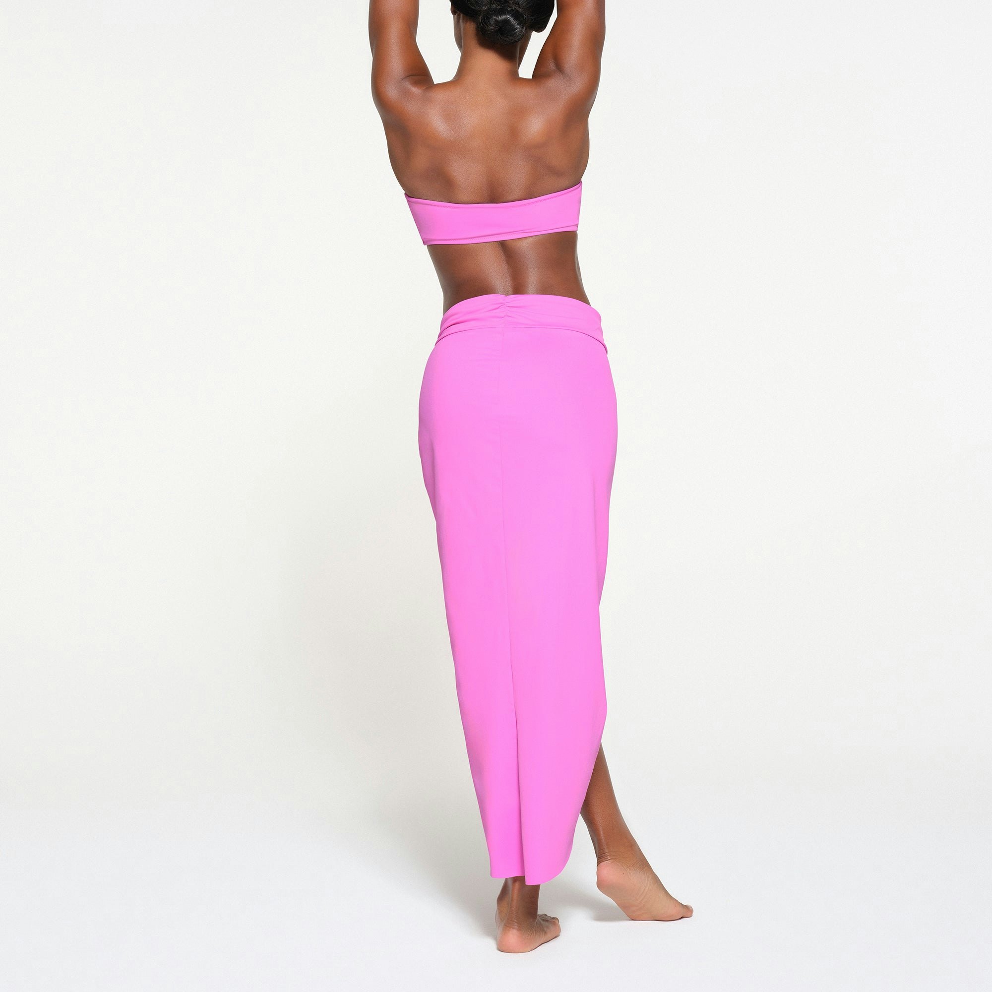 SIGNATURE SWIM SARONG SKIRT | NEON ORCHID ON A MODEL BACK VIEW