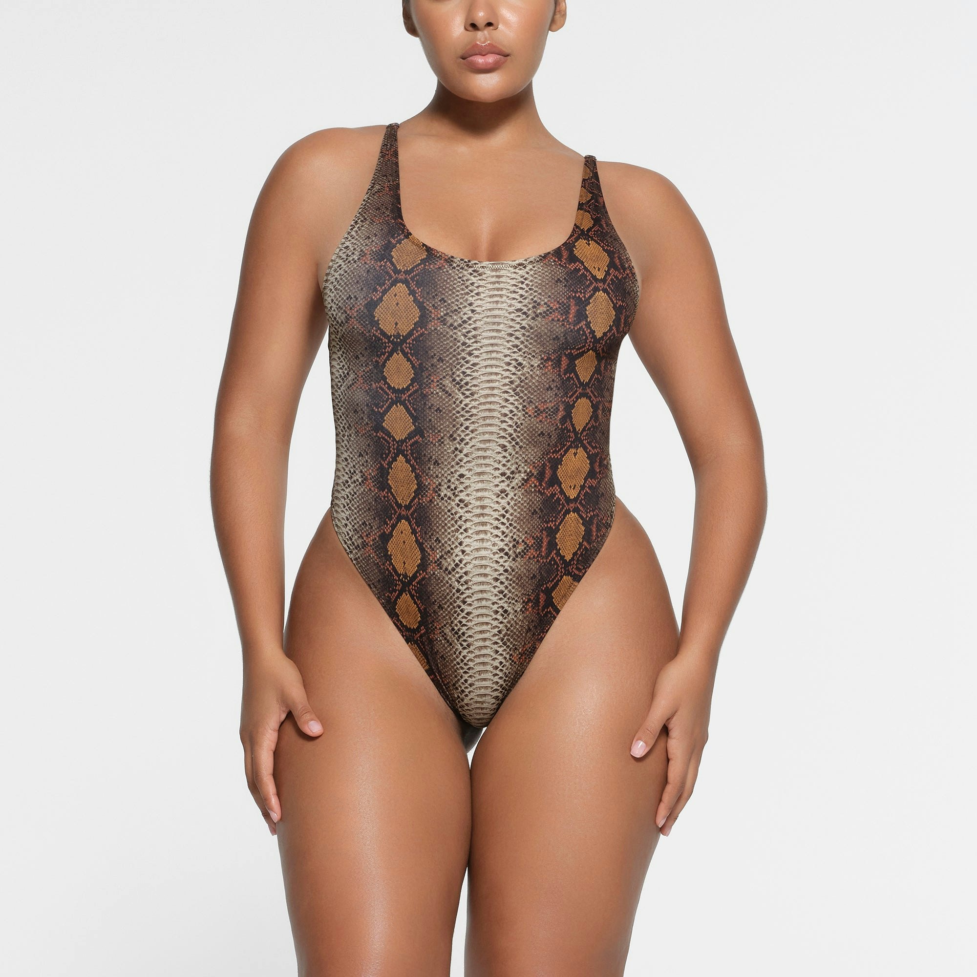 SIGNATURE SWIM SCOOP NECK ONE PIECE | DESERT SNAKE PRINT ON A MODEL FRONT VIEW