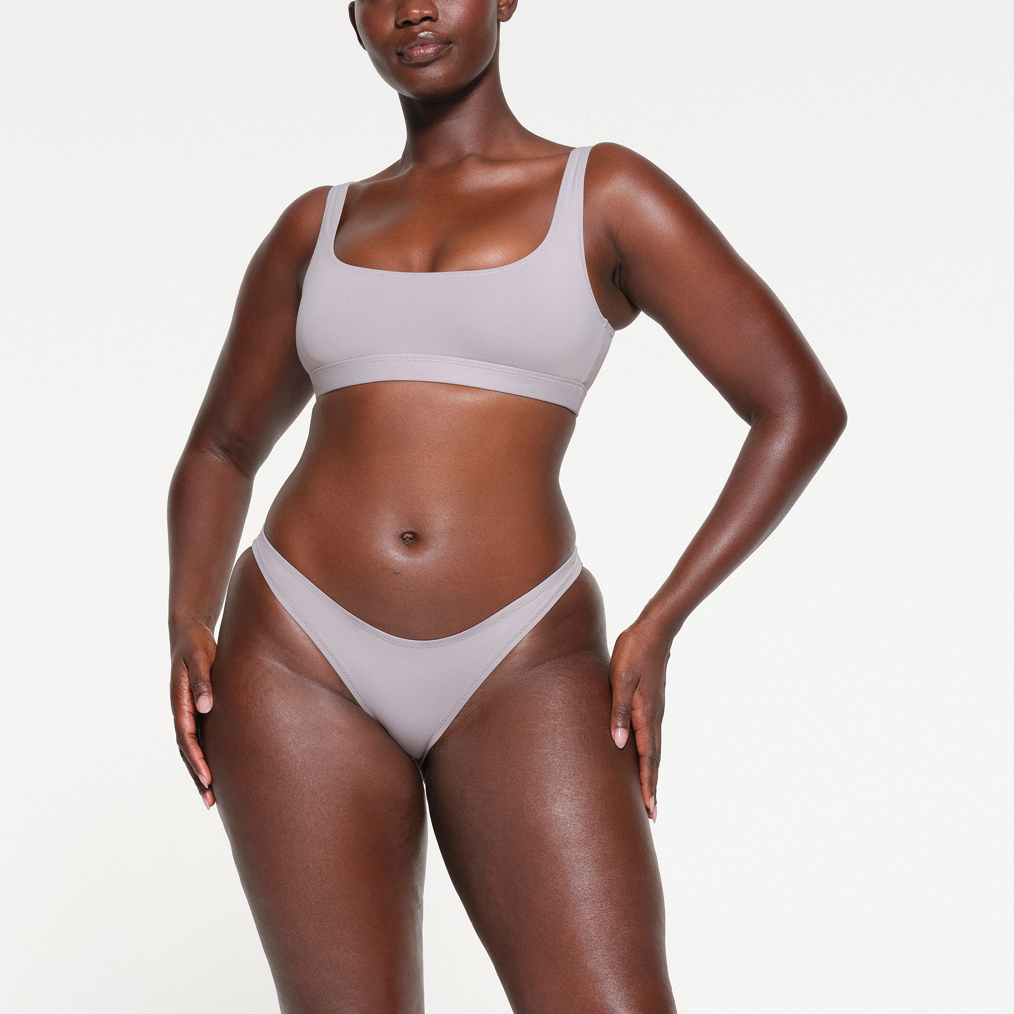 SIGNATURE SWIM CHEEKY TANGA BOTTOMS | CHROME ON A MODEL FRONT VIEW