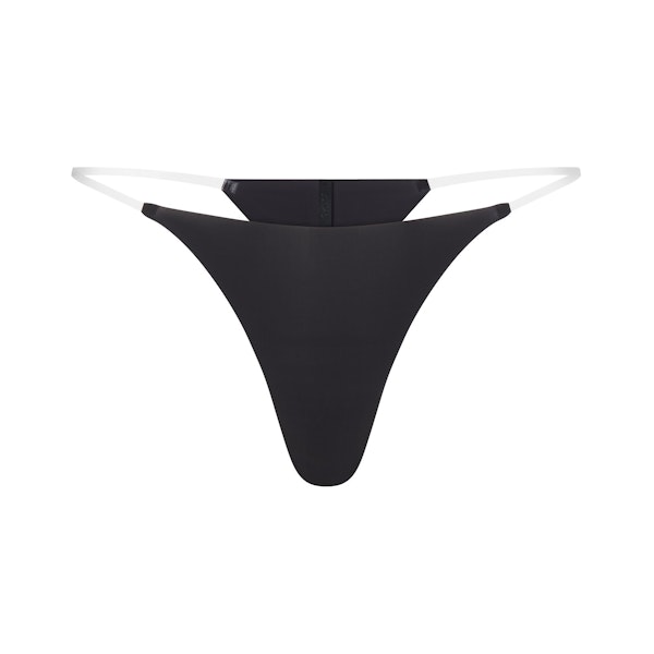 INVISIBLE CLEAR STRAP STRING THONG | ONYX LAYS FLAT ON A WHITE BACKGROUND | FLT 