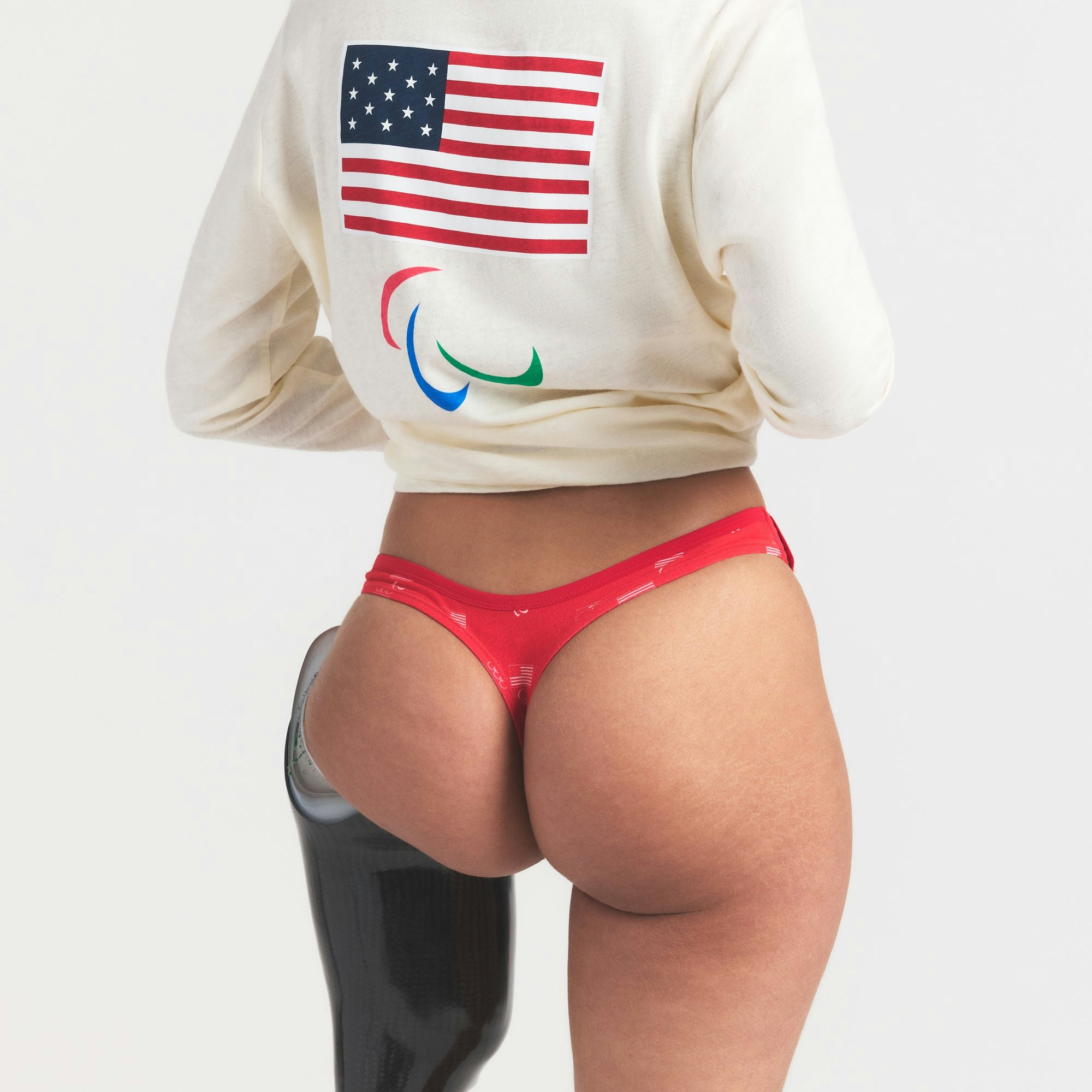 SKIMS FOR TEAM USA COTTON JERSEY PARALYMPIC THONG 3-PACK | SKIMS FOR TEAM USA OLYMPIC MULTI ON A MODEL SIDE VIEW @ | FOCUS: 0.0, 1.0, 0.9
