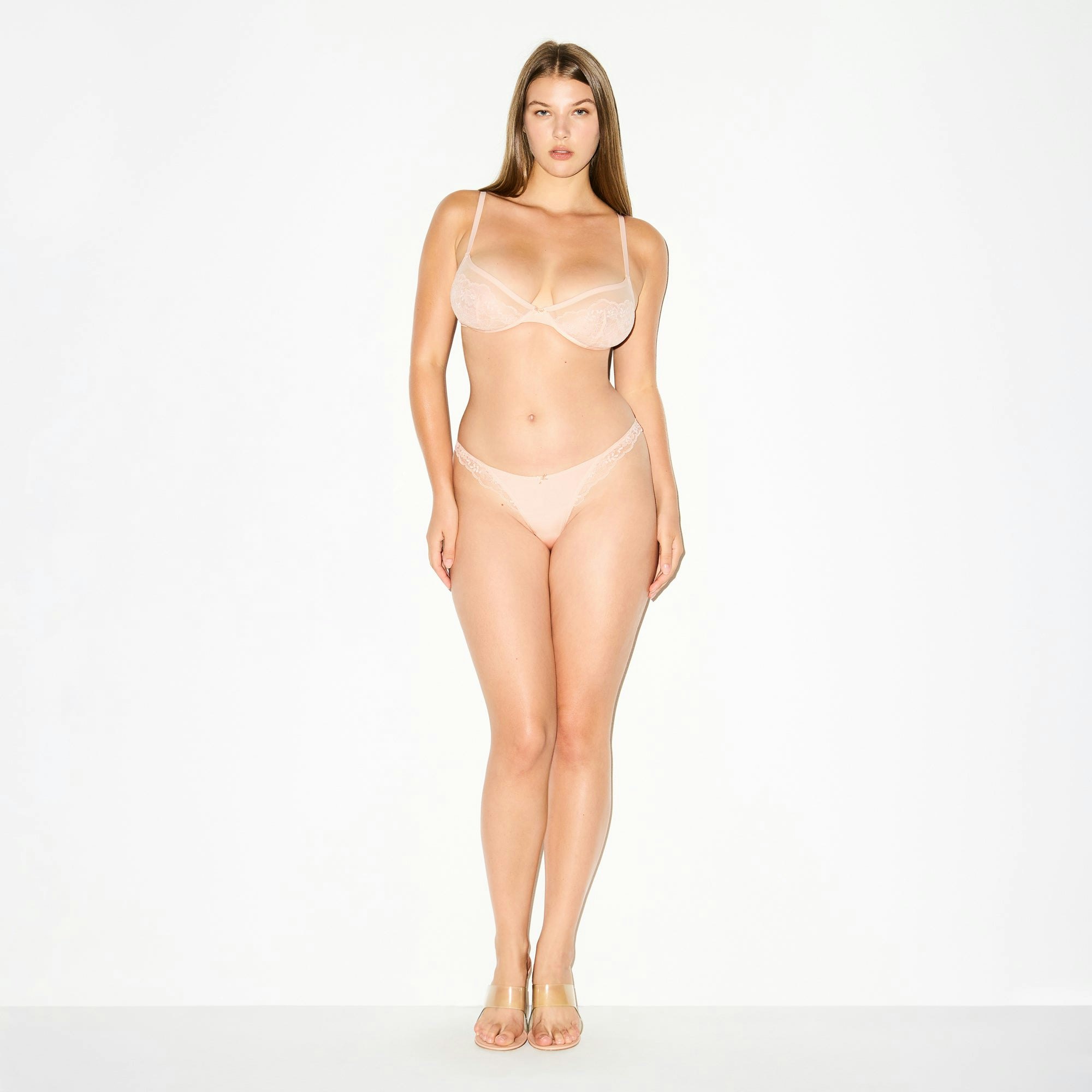 SKIMS LACE THONG | PRIMROSE ON A MODEL FRONT VIEW @ | FOCUS: 0.0, 1.0, 0.9