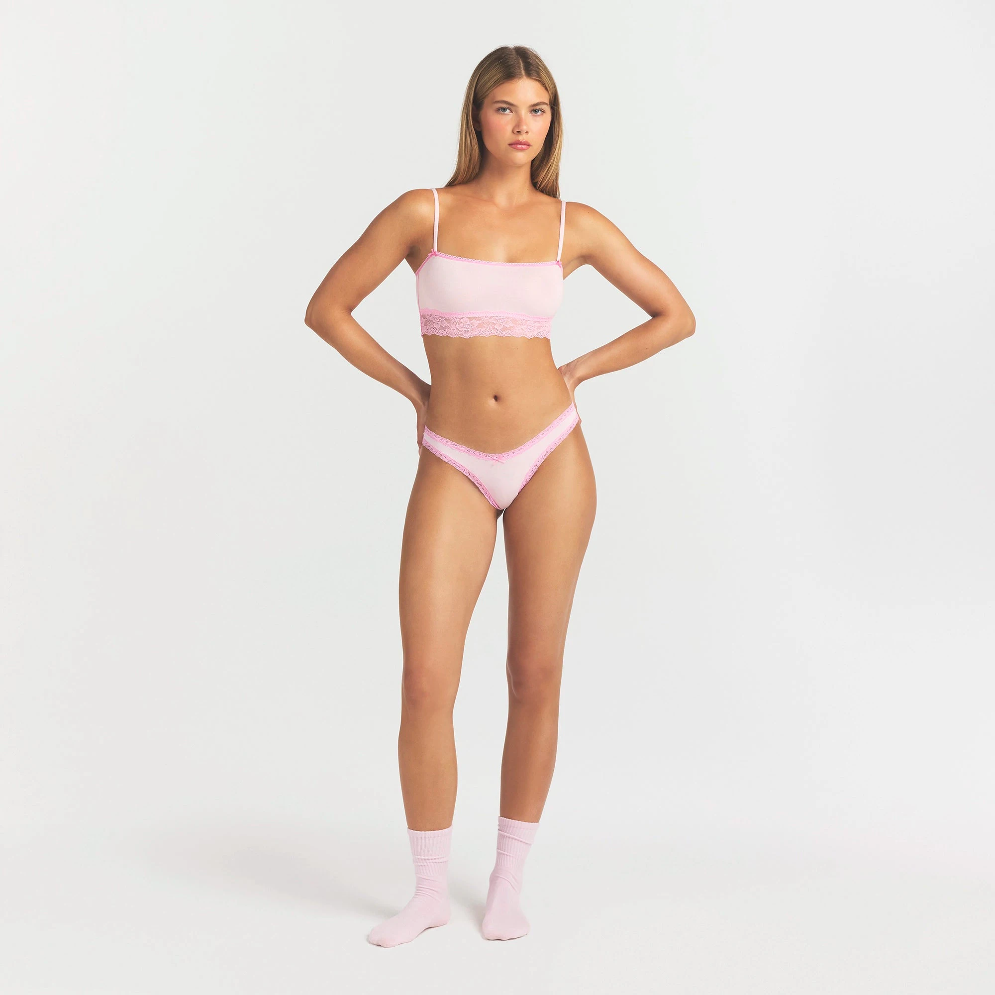 LIGHTWEIGHT COTTON LACE THONG | CHERRY BLOSSOM ON A MODEL FRONT VIEW