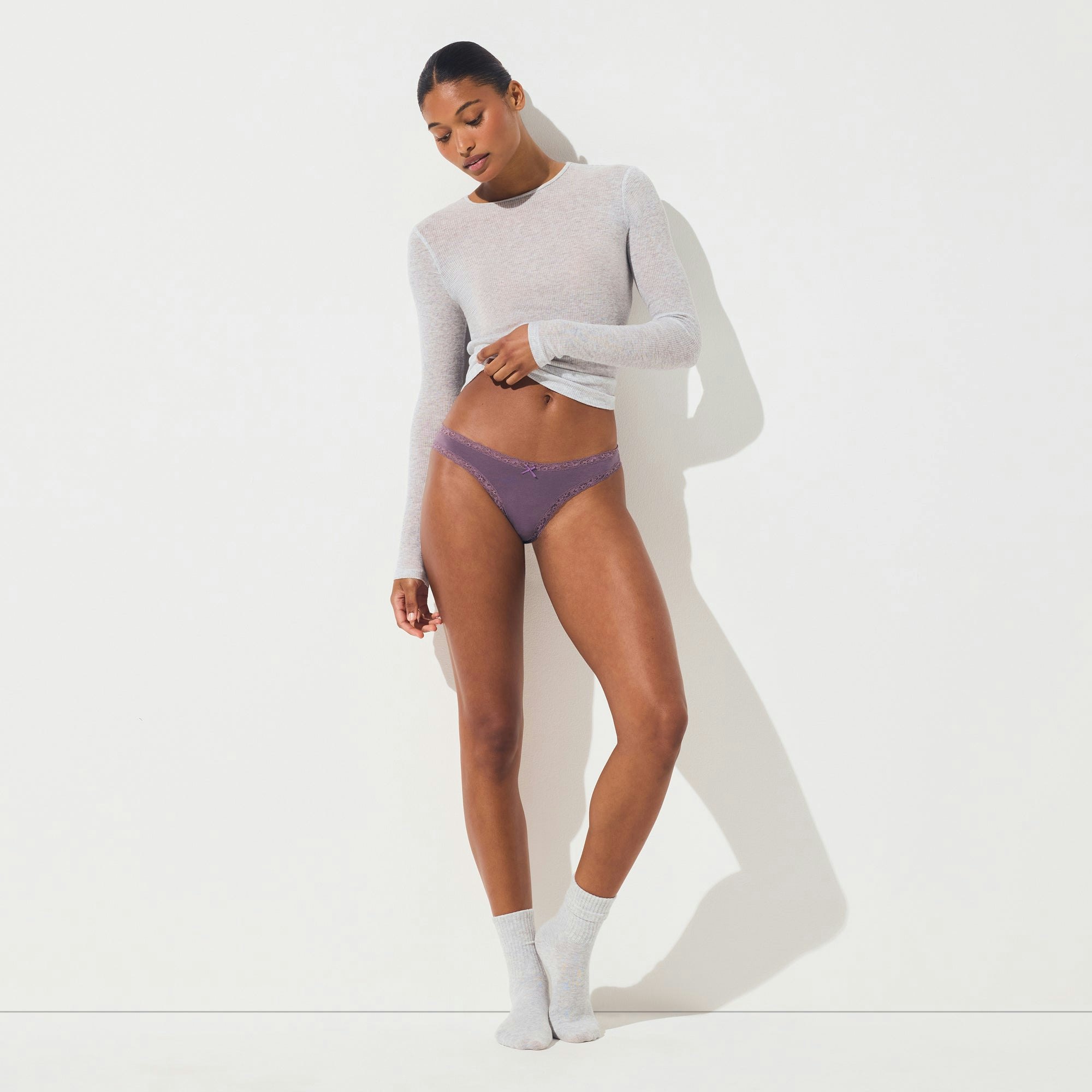LIGHTWEIGHT COTTON LACE THONG | FIG TONAL ON A MODEL FRONT VIEW @ | FOCUS: 0.0, 1.0, 0.9