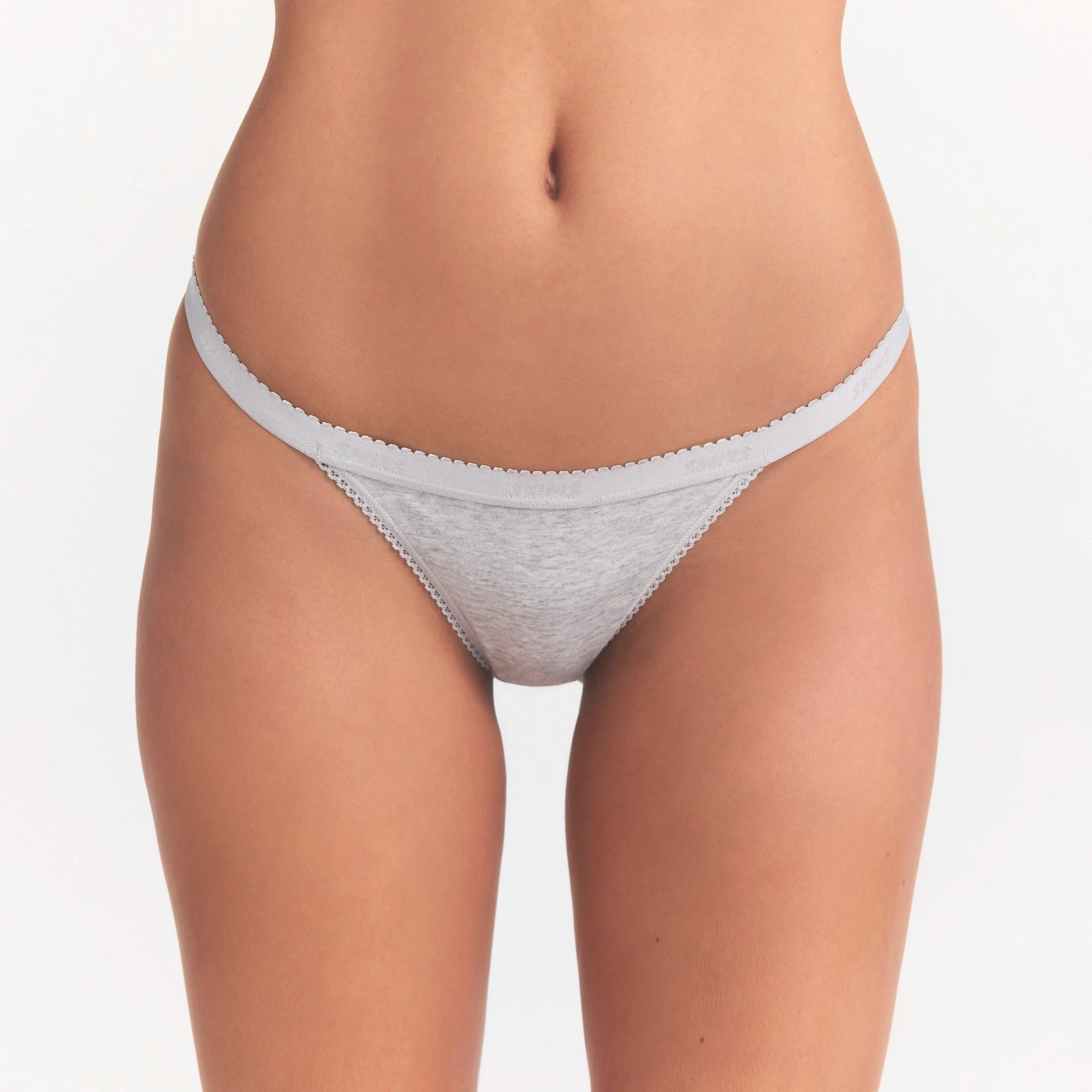 LIGHTWEIGHT COTTON LOGO PICOT THONG | LIGHT HEATHER GREY ON A MODEL SIDE VIEW | FOCUS: 0.0, 1.0, 0.9