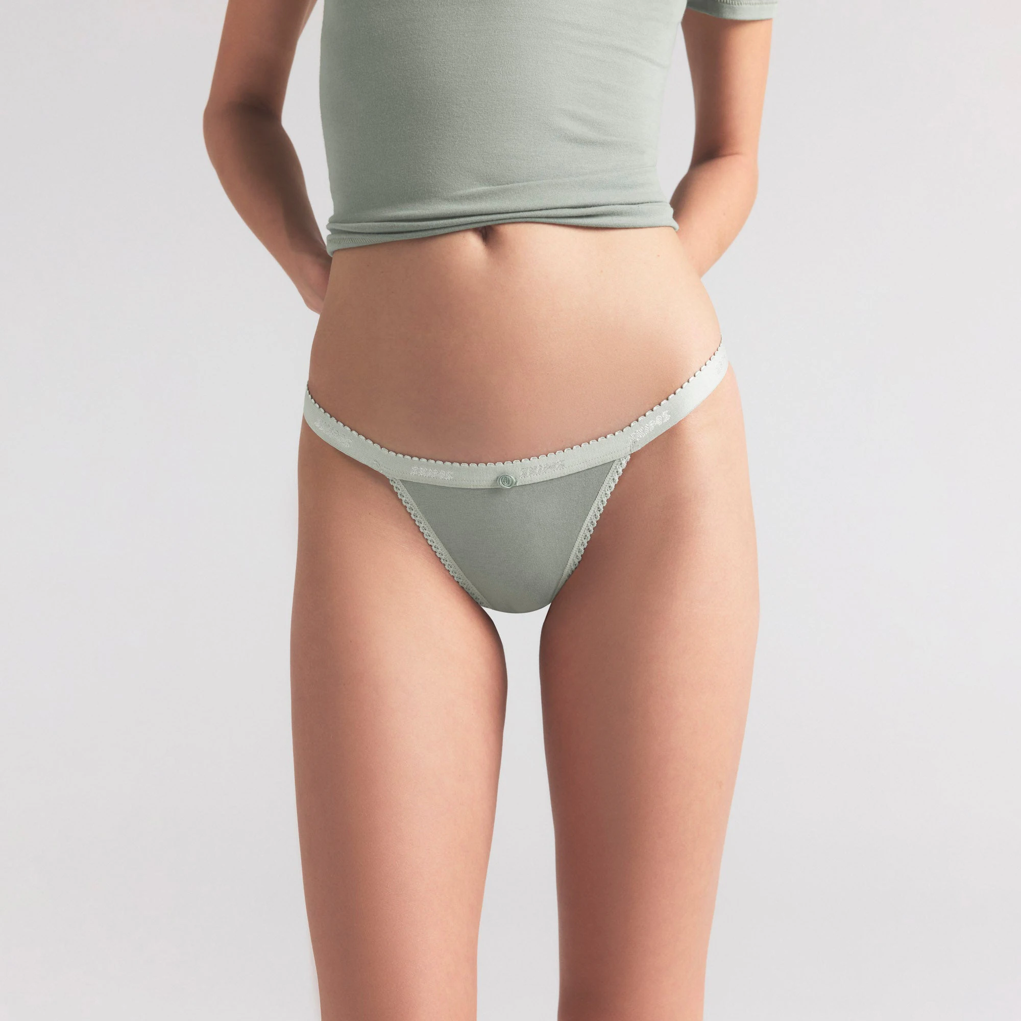 LIGHTWEIGHT COTTON LOGO PICOT THONG | MINERAL ON A MODEL SIDE VIEW | FOCUS: 0.0, 1.0, 0.9