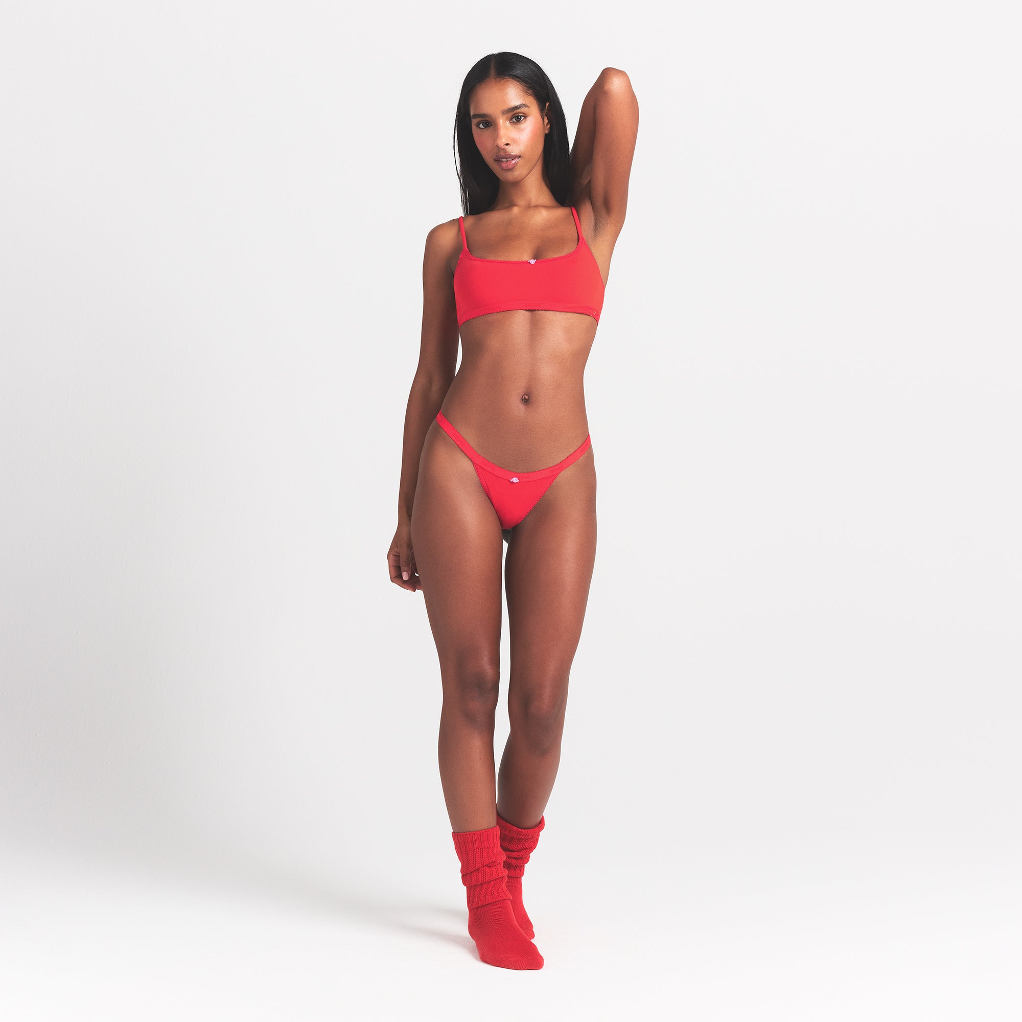LIGHTWEIGHT COTTON LOGO PICOT THONG | RUBY TONAL ON A MODEL FRONT VIEW @ | FOCUS: 0.0, 1.0, 0.9